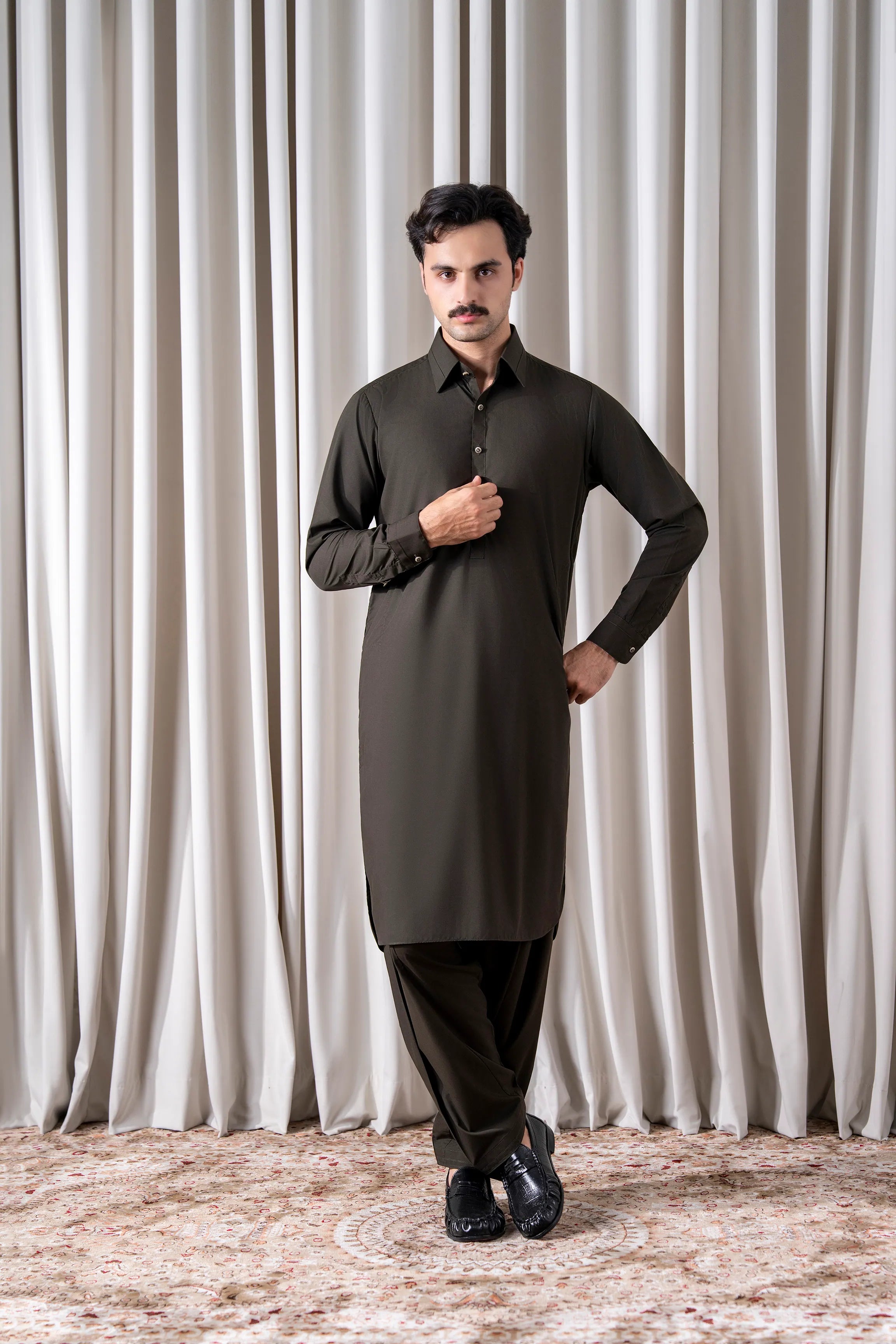 Olive blended kameez shalwar: long button-up kurta with matching trousers.