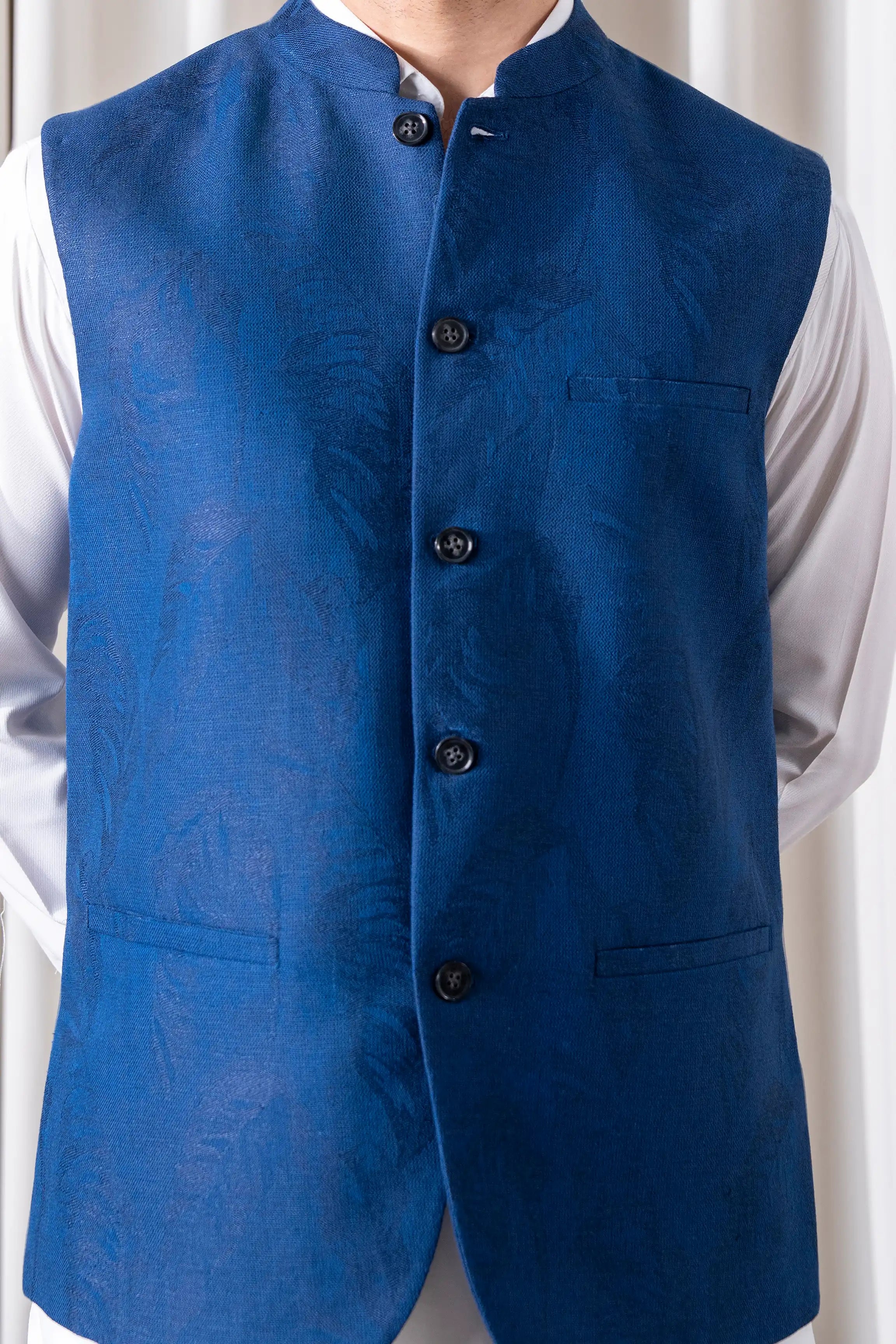 Indigo cotton-linen waistcoat close-up with button placket and chest pockets