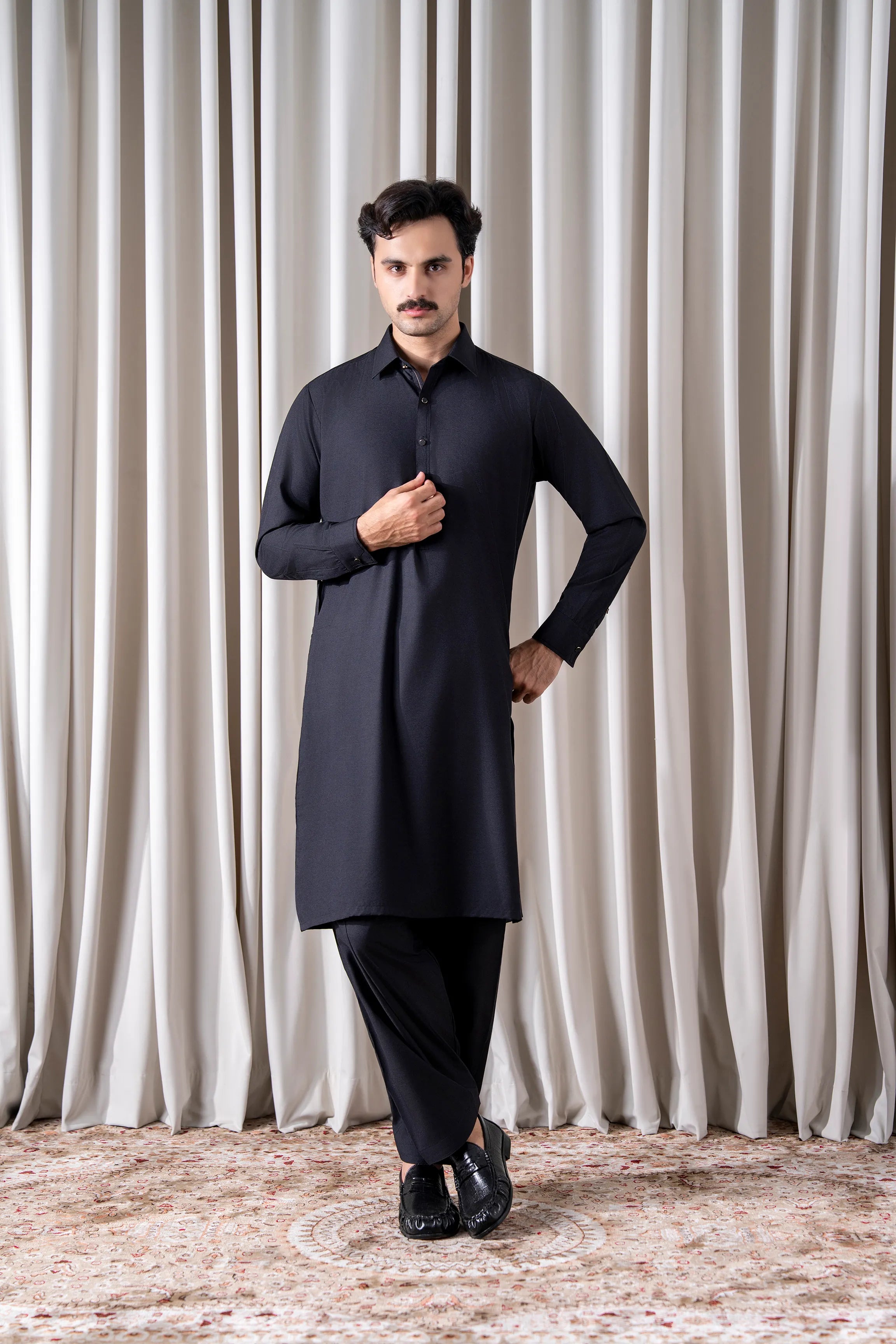 Black textured kameez shalwar set with long tunic collar and button placket, matching pants