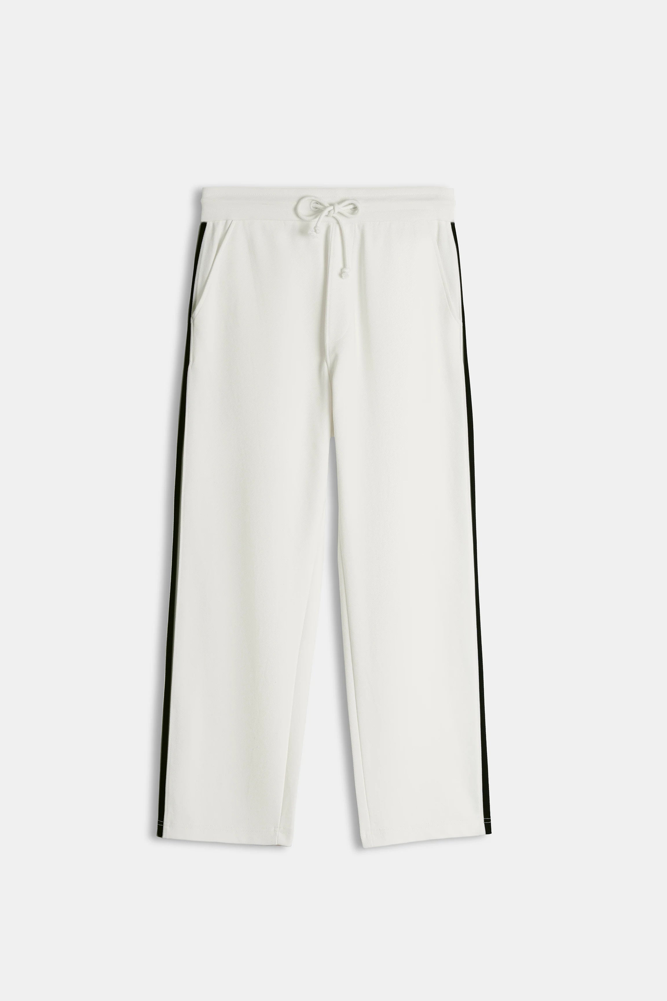 Off-white loose-fit trousers, drawstring waist, black side stripes