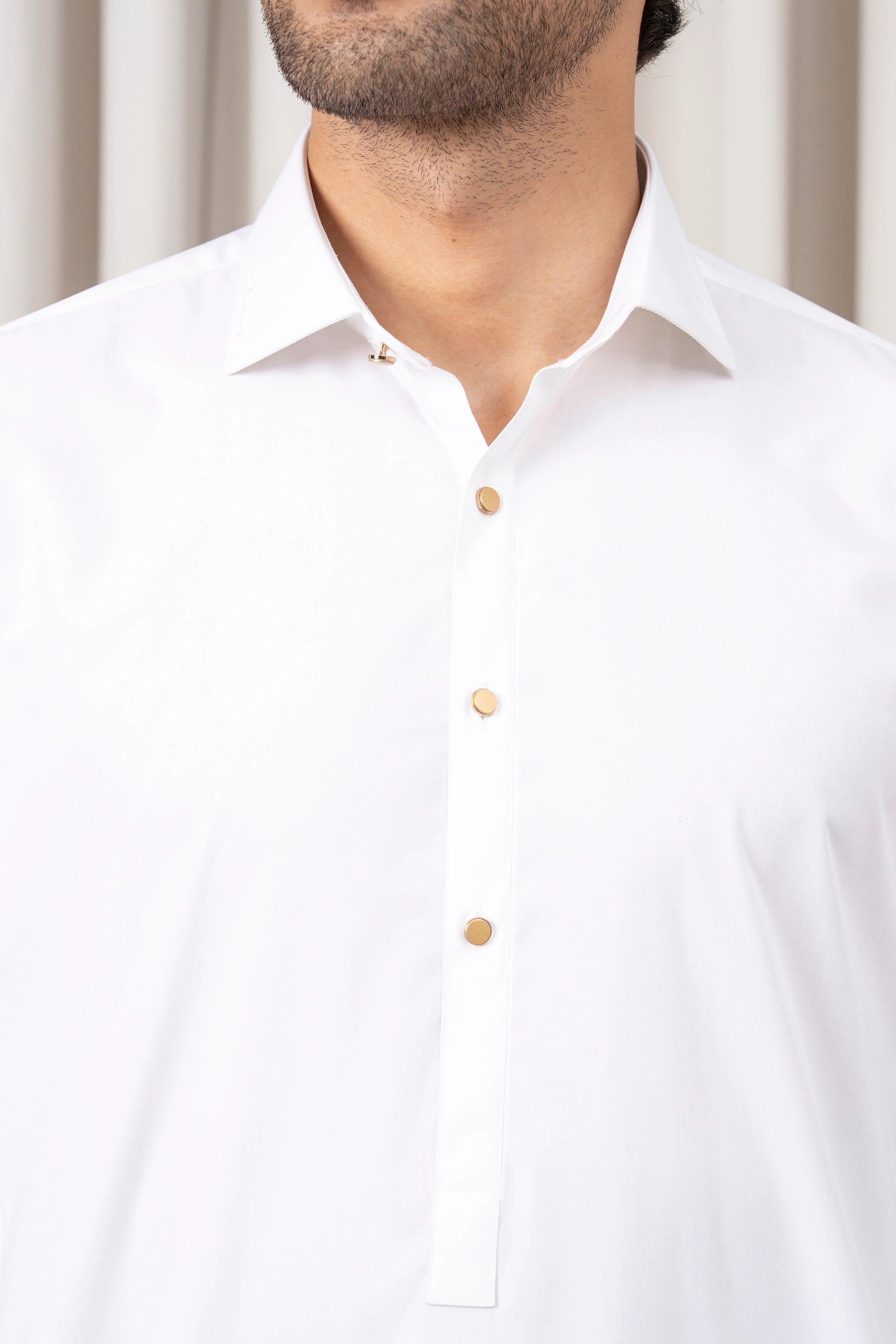 White kameez neckline with button placket and pointed collar detail