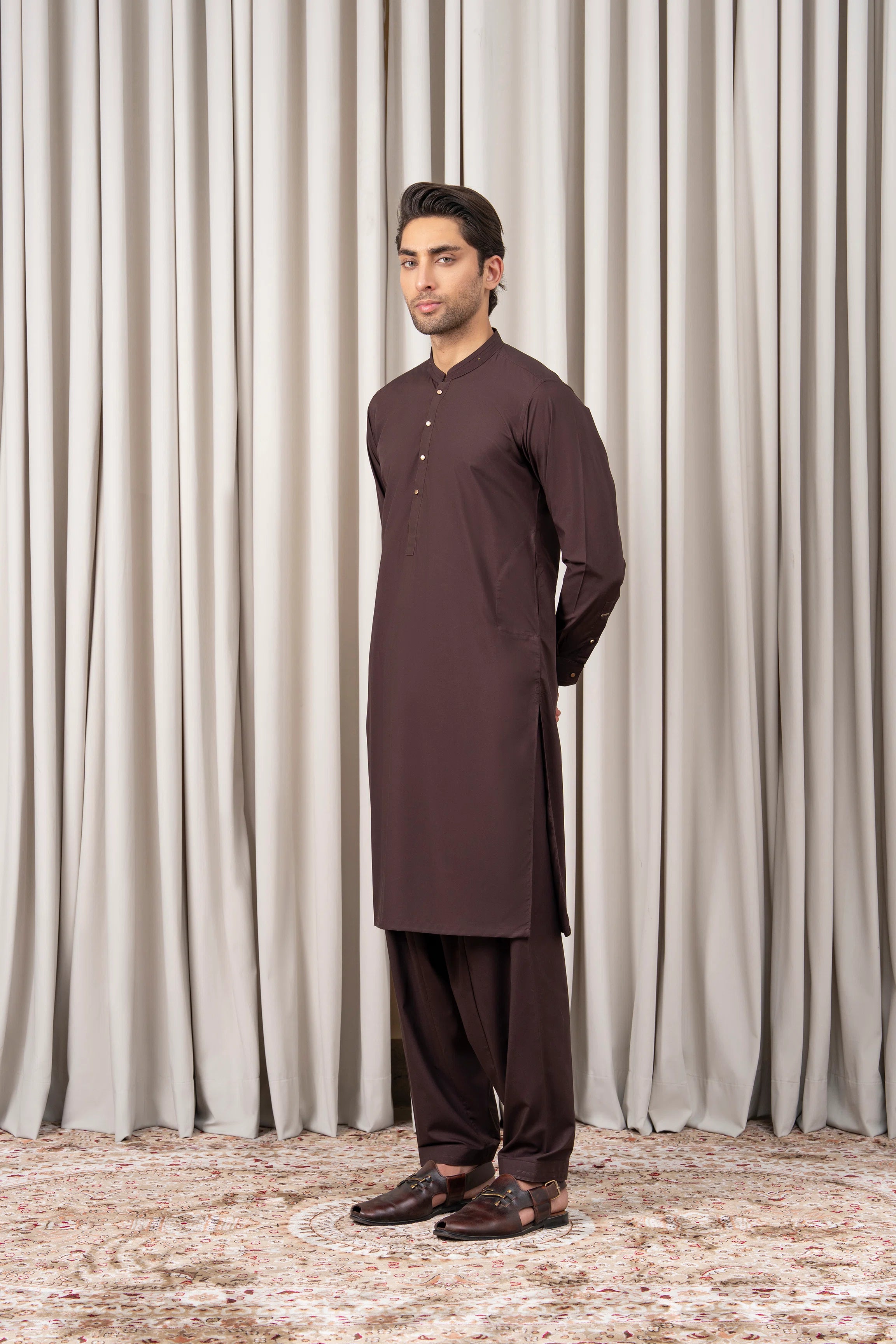 Men's dark brown kameez shalwar with button-front kurta and matching trousers, side view