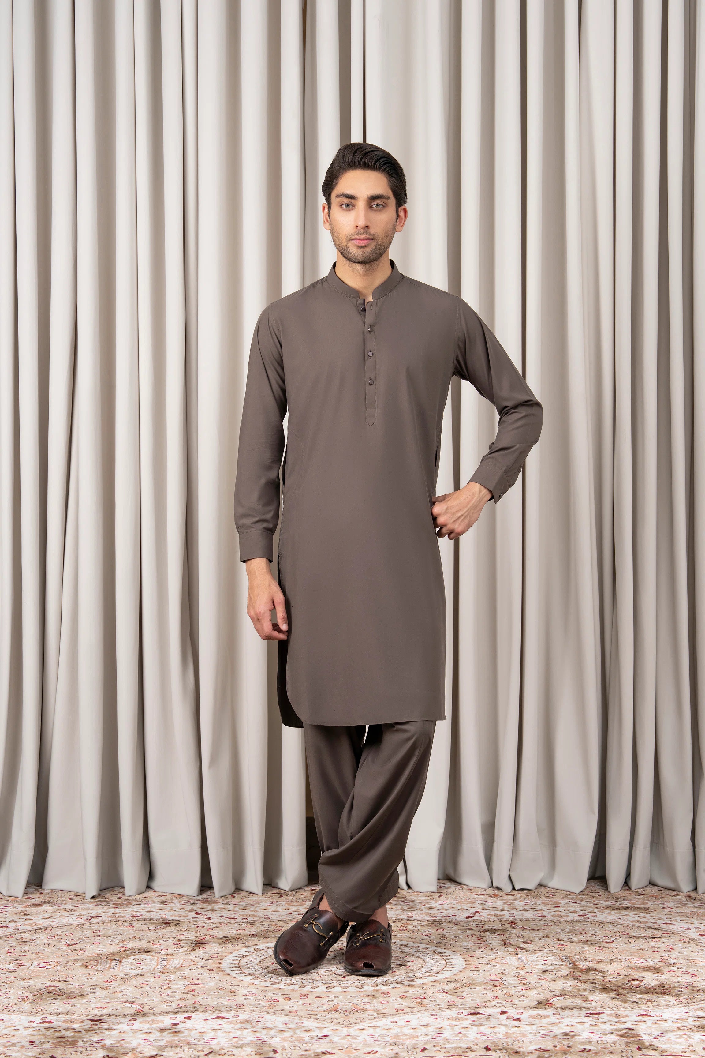 Mid-brown kameez shalwar set, long tunic and matching trousers from the back