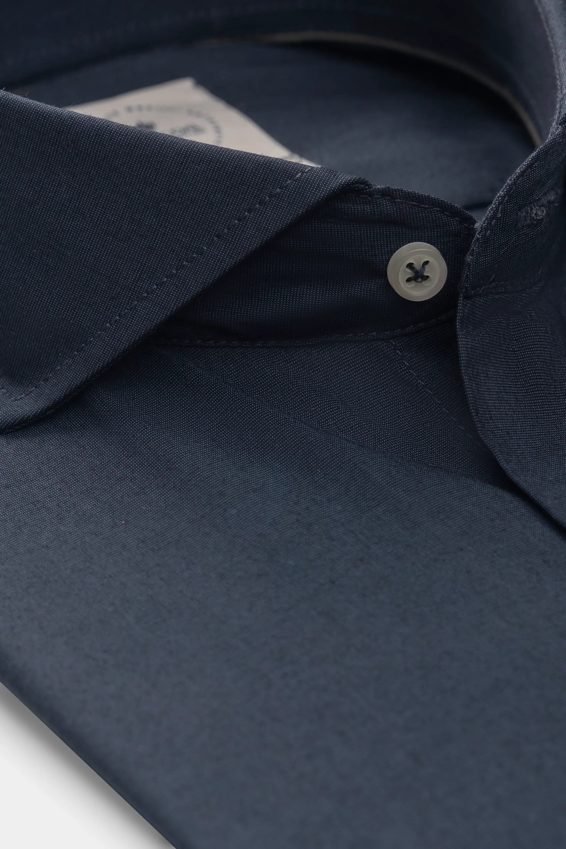 Dark blue French-collar smart shirt neckline with button and collar detail