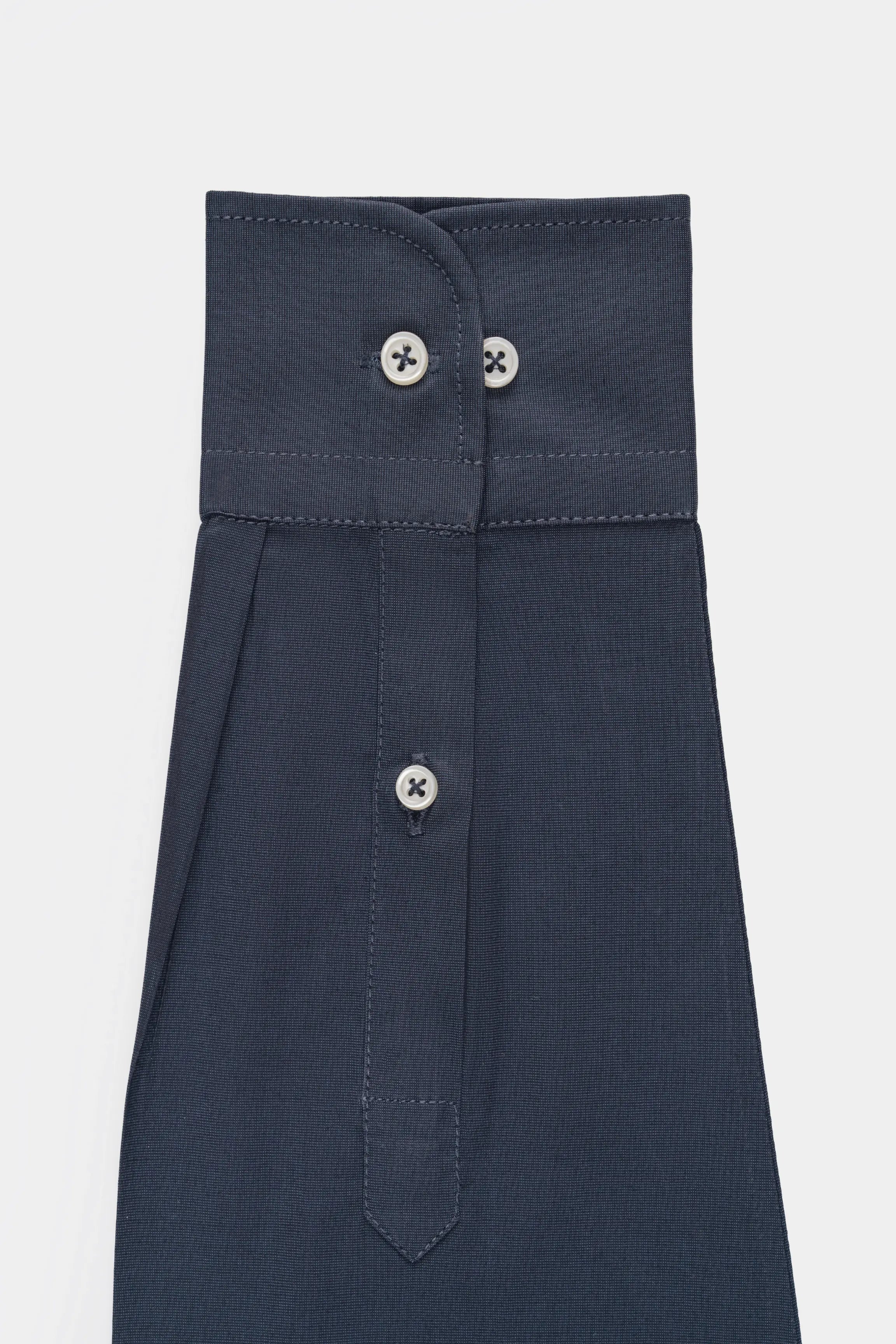 Dark blue smart shirt front placket with three buttons and stitched yoke