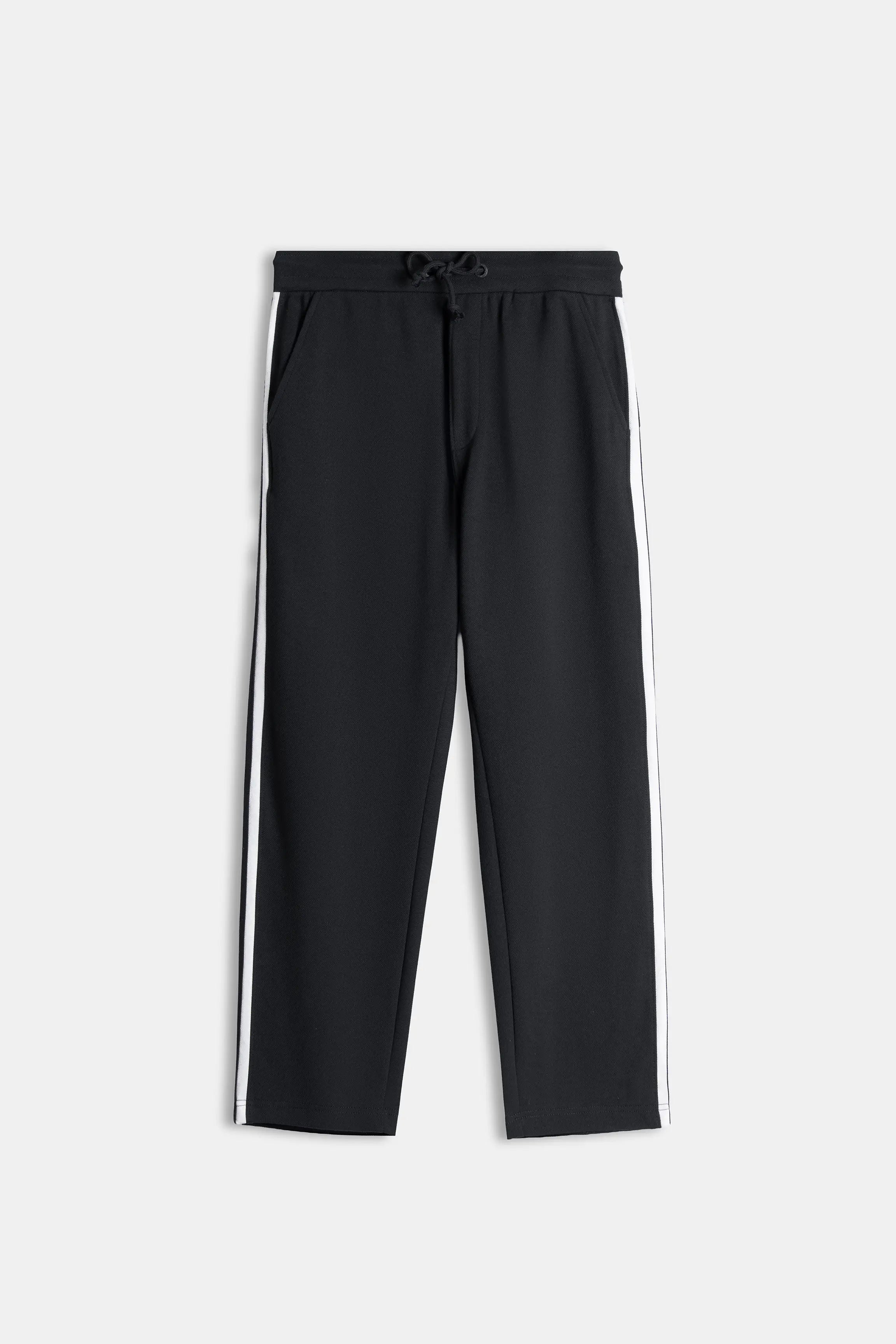Black loose-fit trousers, elastic waistband with drawstring and side stripe