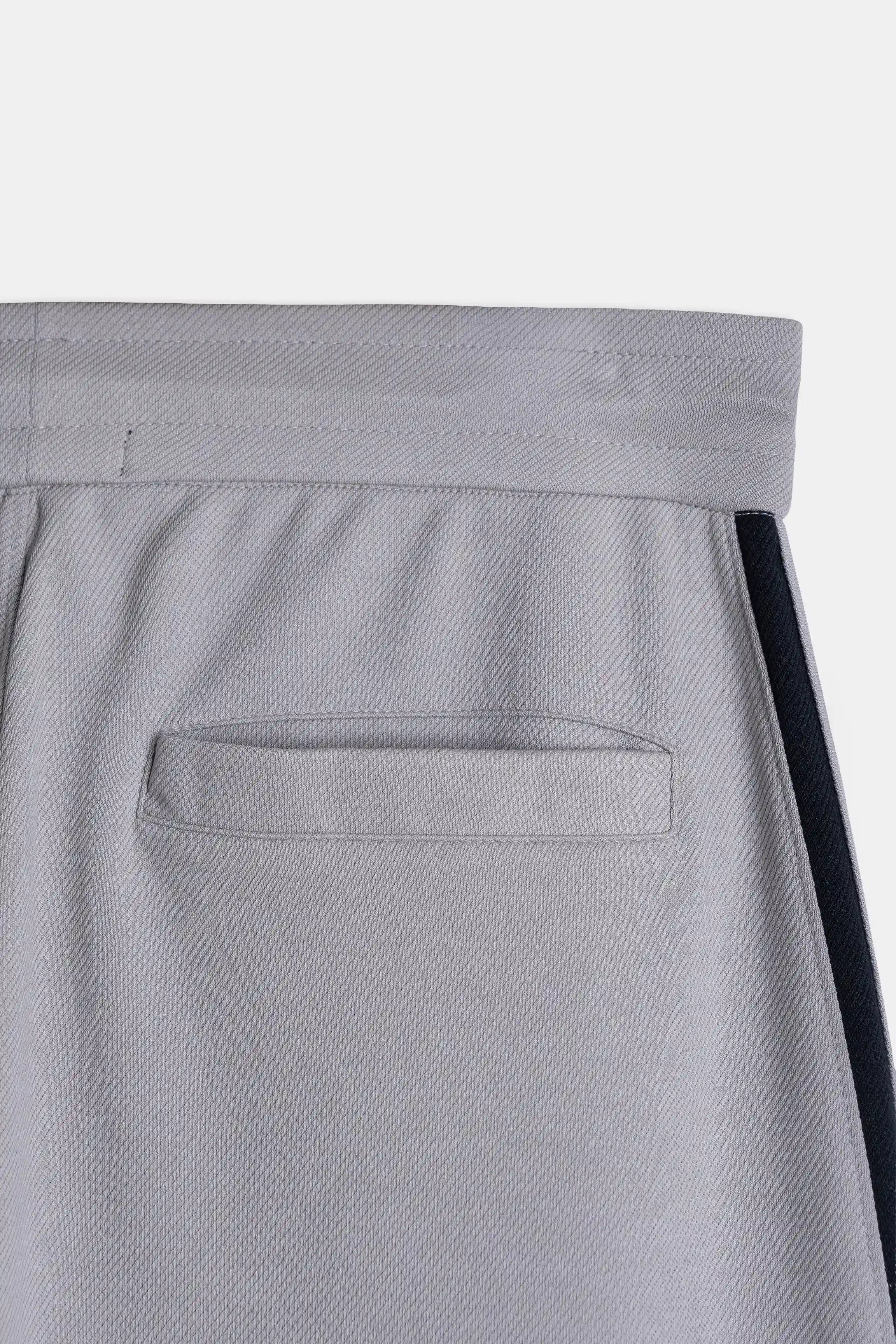 Grey back pocket detail with navy side stripe and elastic waistband top