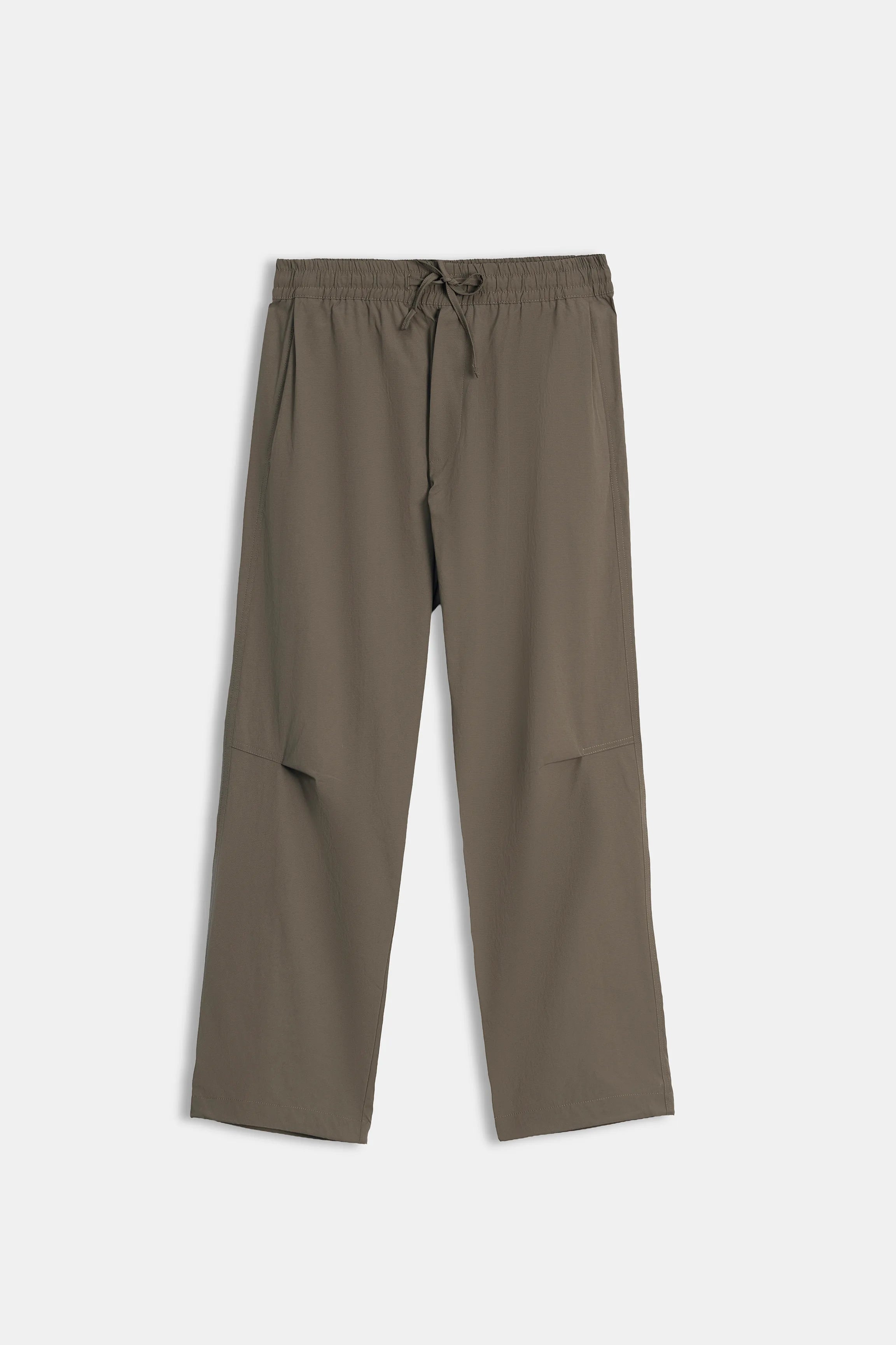 Olive loose-fit casual trousers flat lay with elastic waist and drawstring tie