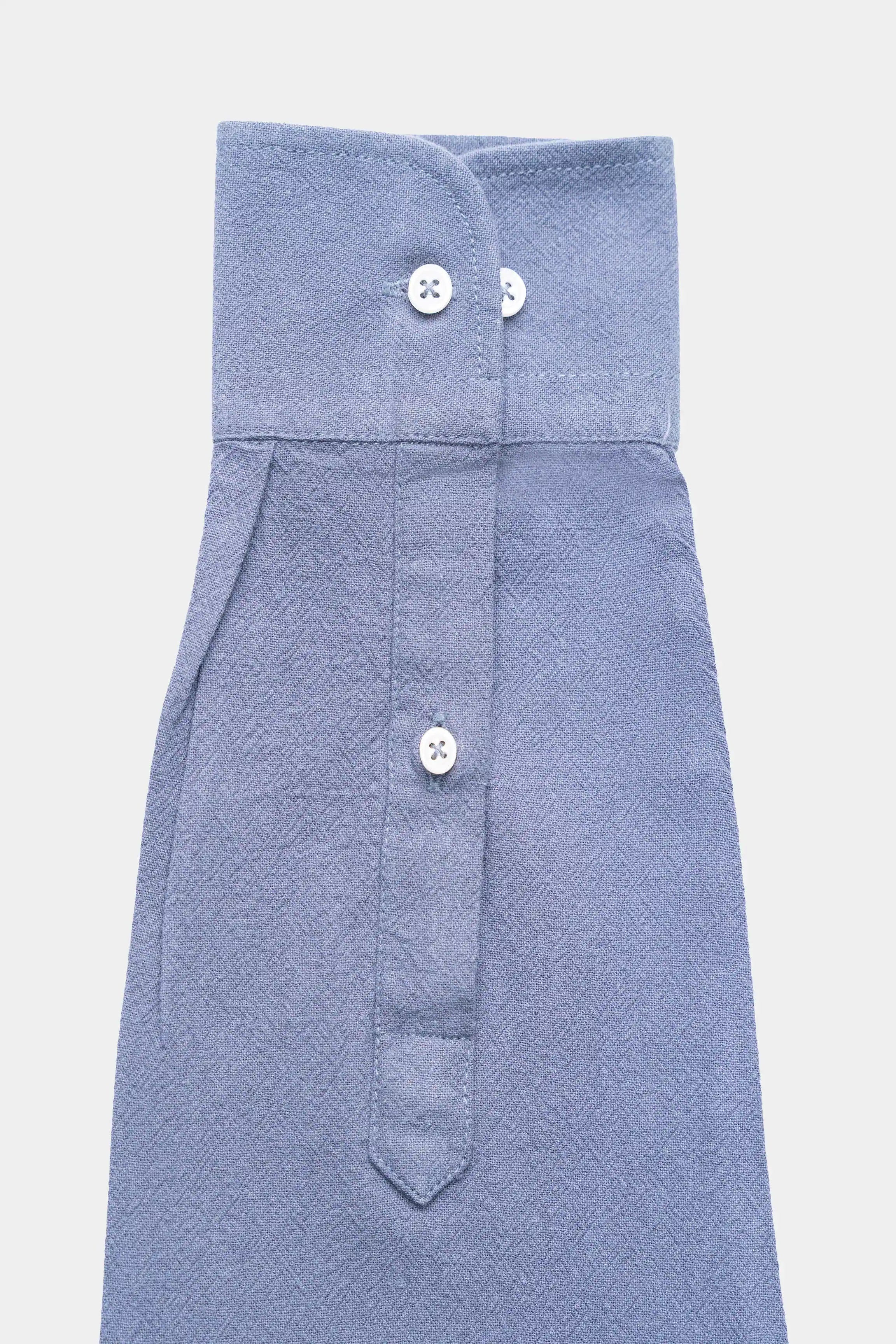 Grey button-up shirt with point collar and front pocket, laid flat