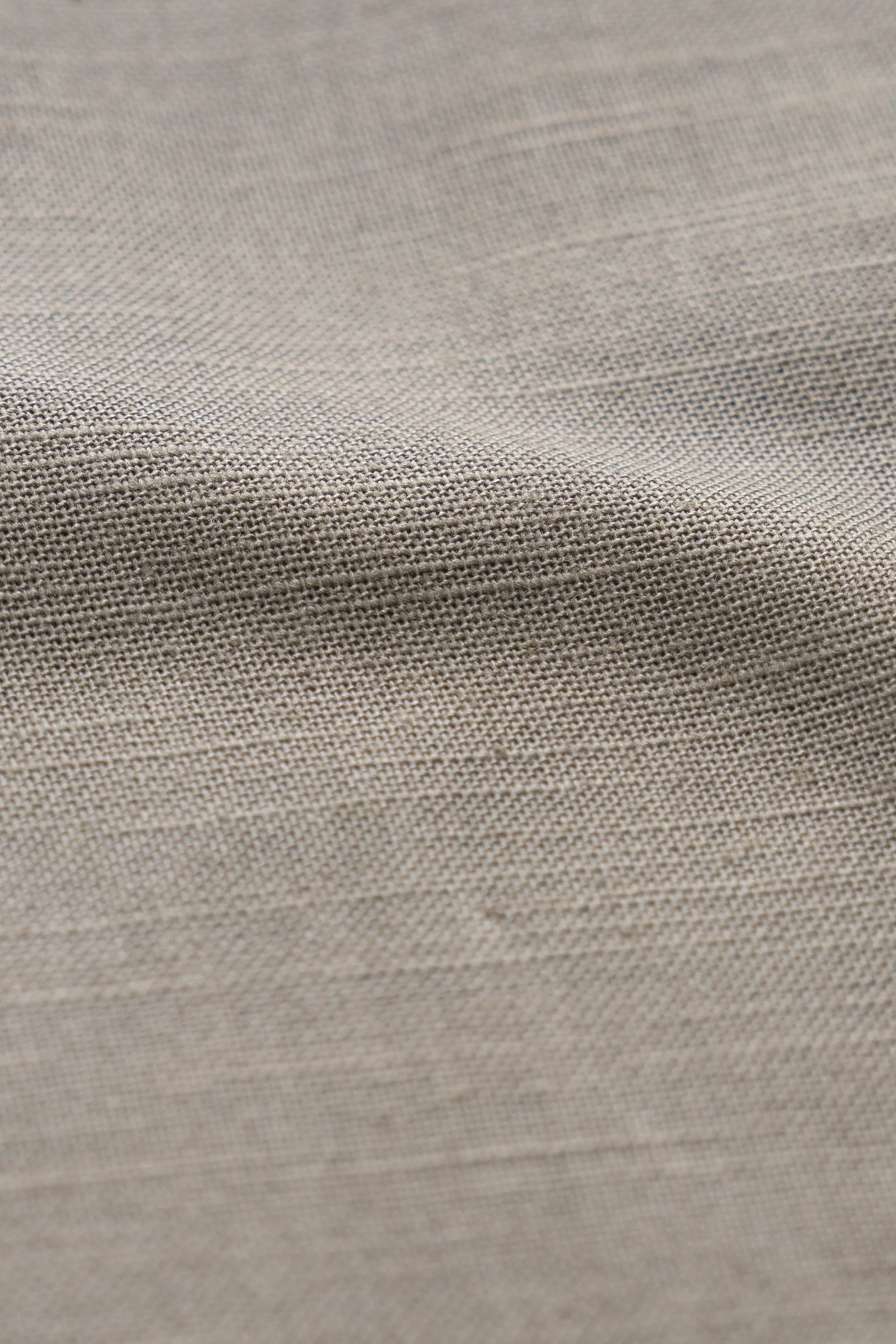 Light olive woven shirt fabric texture, close-up