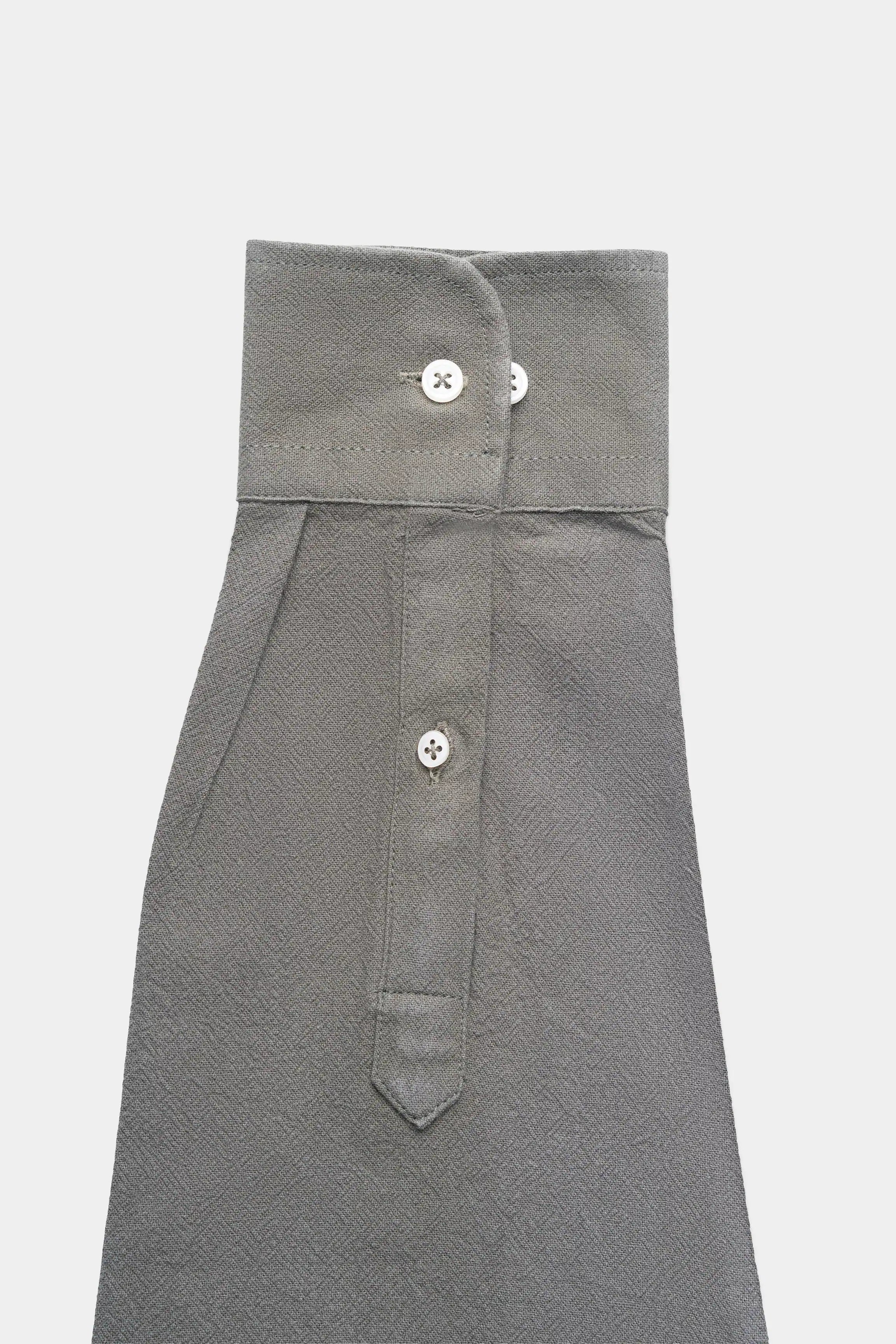 Dark gray button-up shirt with chest pocket flap and visible buttons