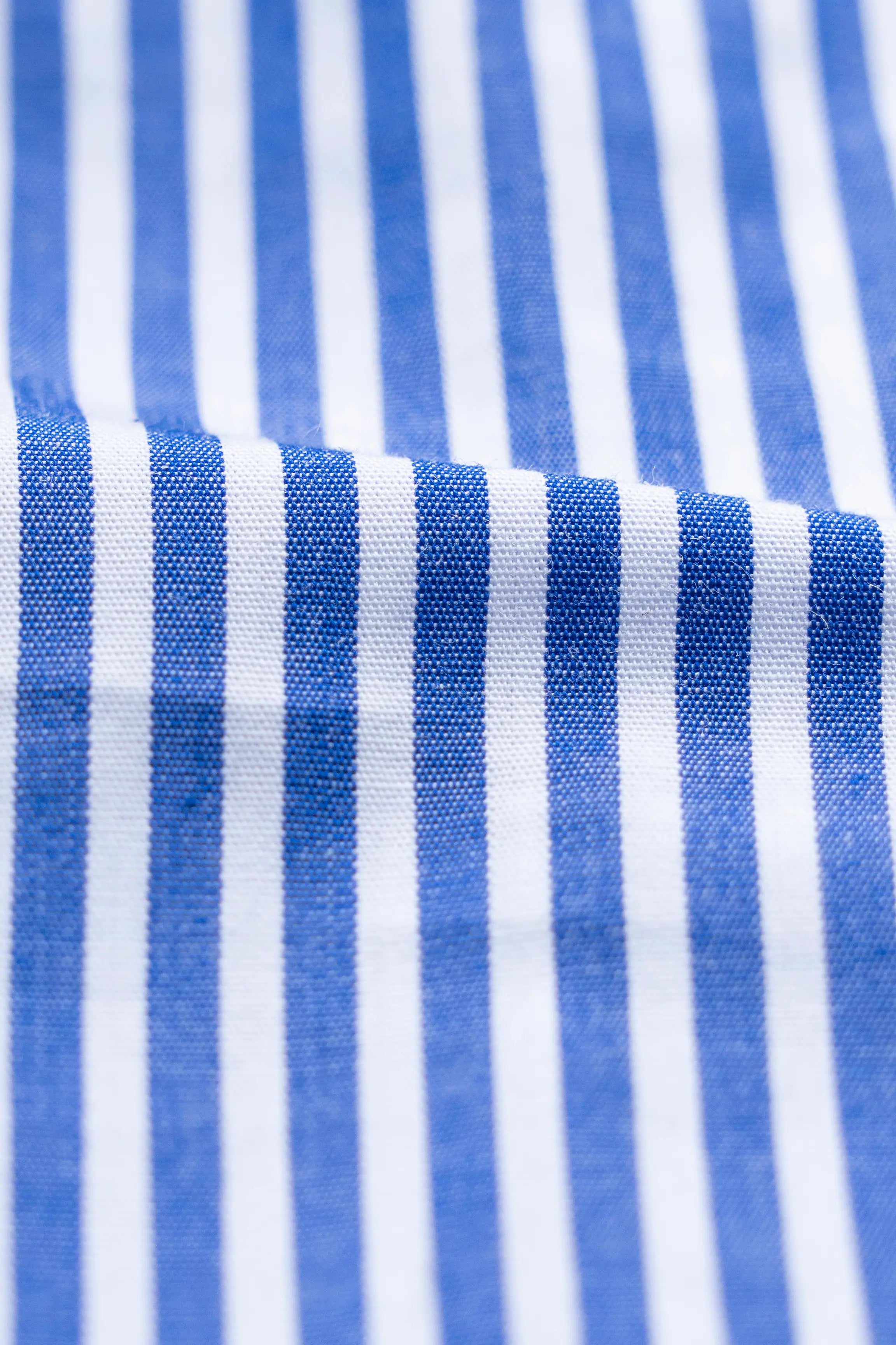 Blue and white striped dress shirt fabric close-up