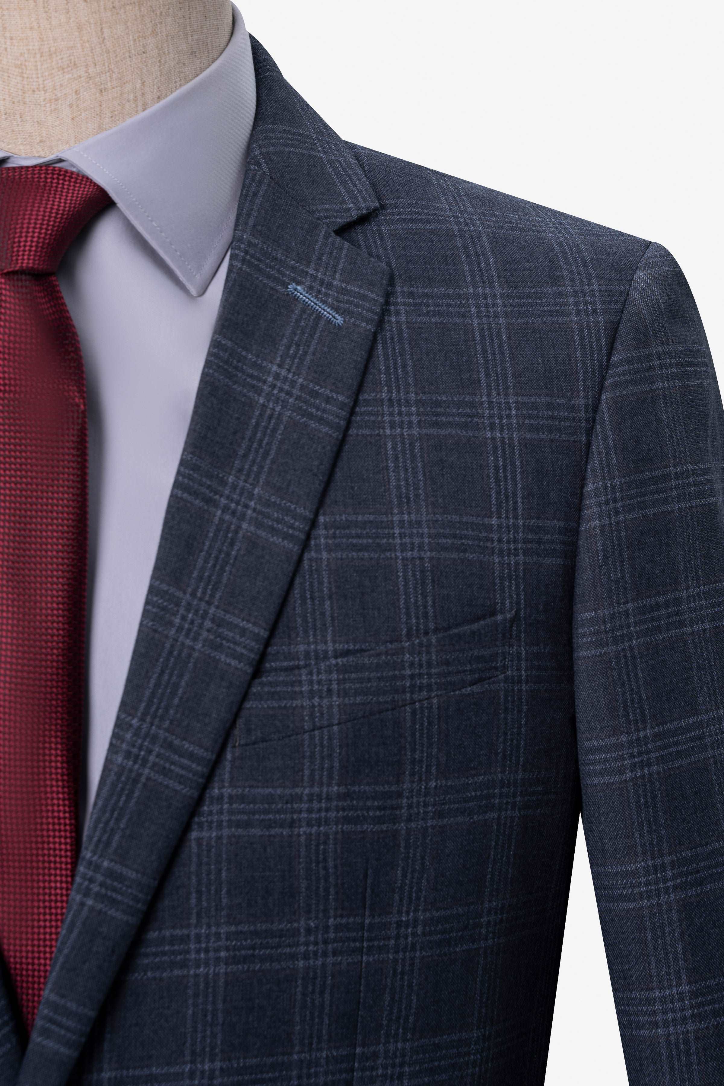 Blue-gray plaid suit jacket shoulder and chest with red necktie