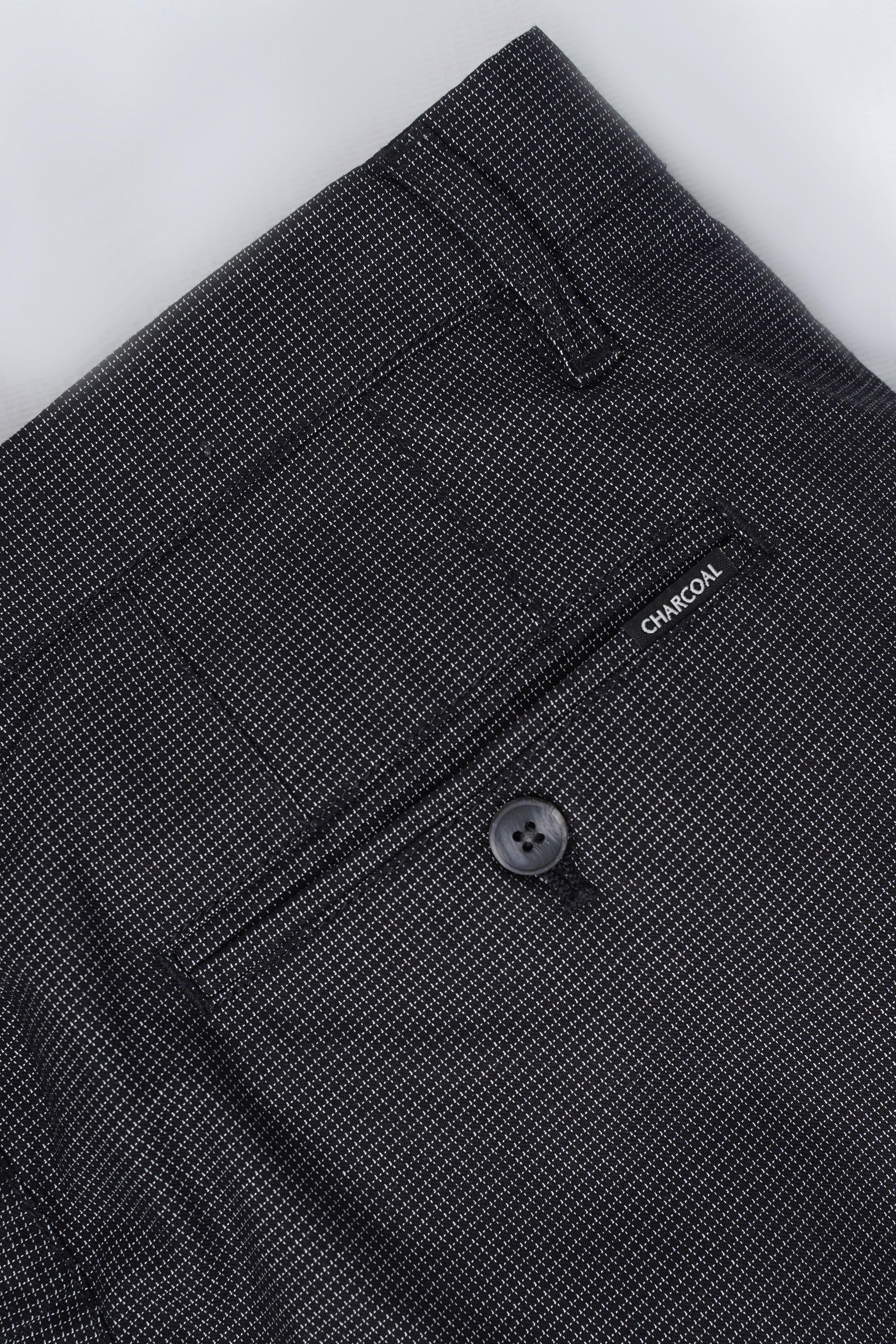 Black casual pants waistband with button closure and 'CHARCOAL' label