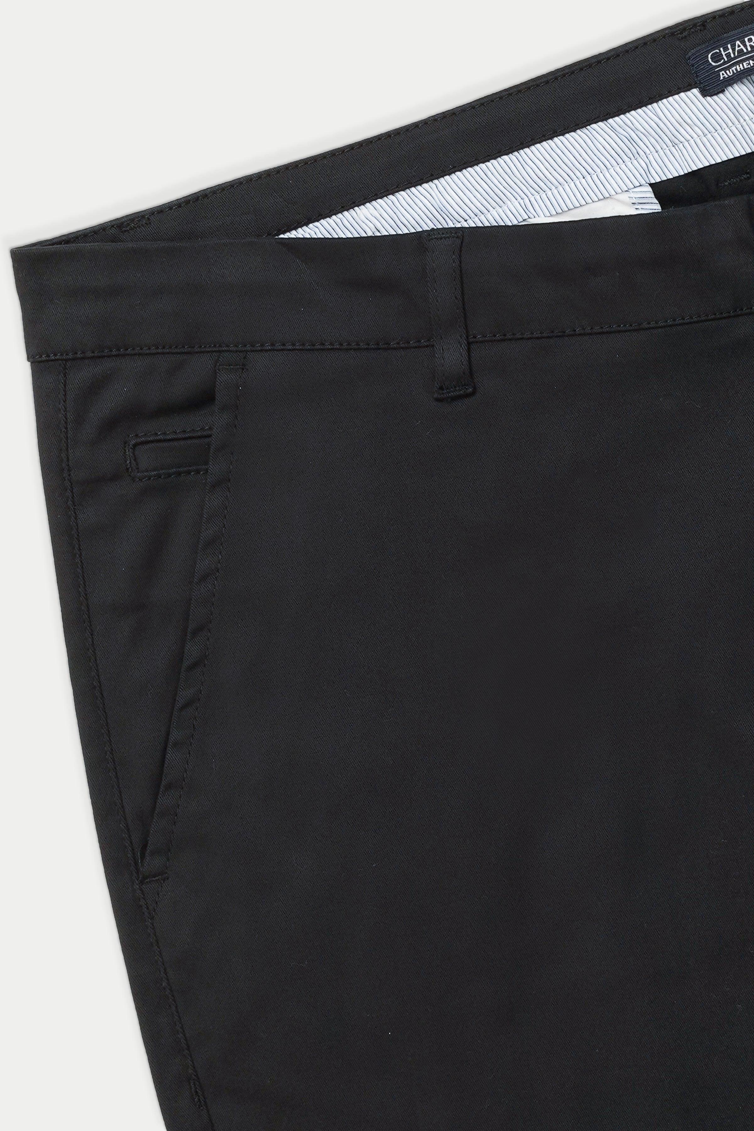 Black casual pants side view with slash pocket and seam detail