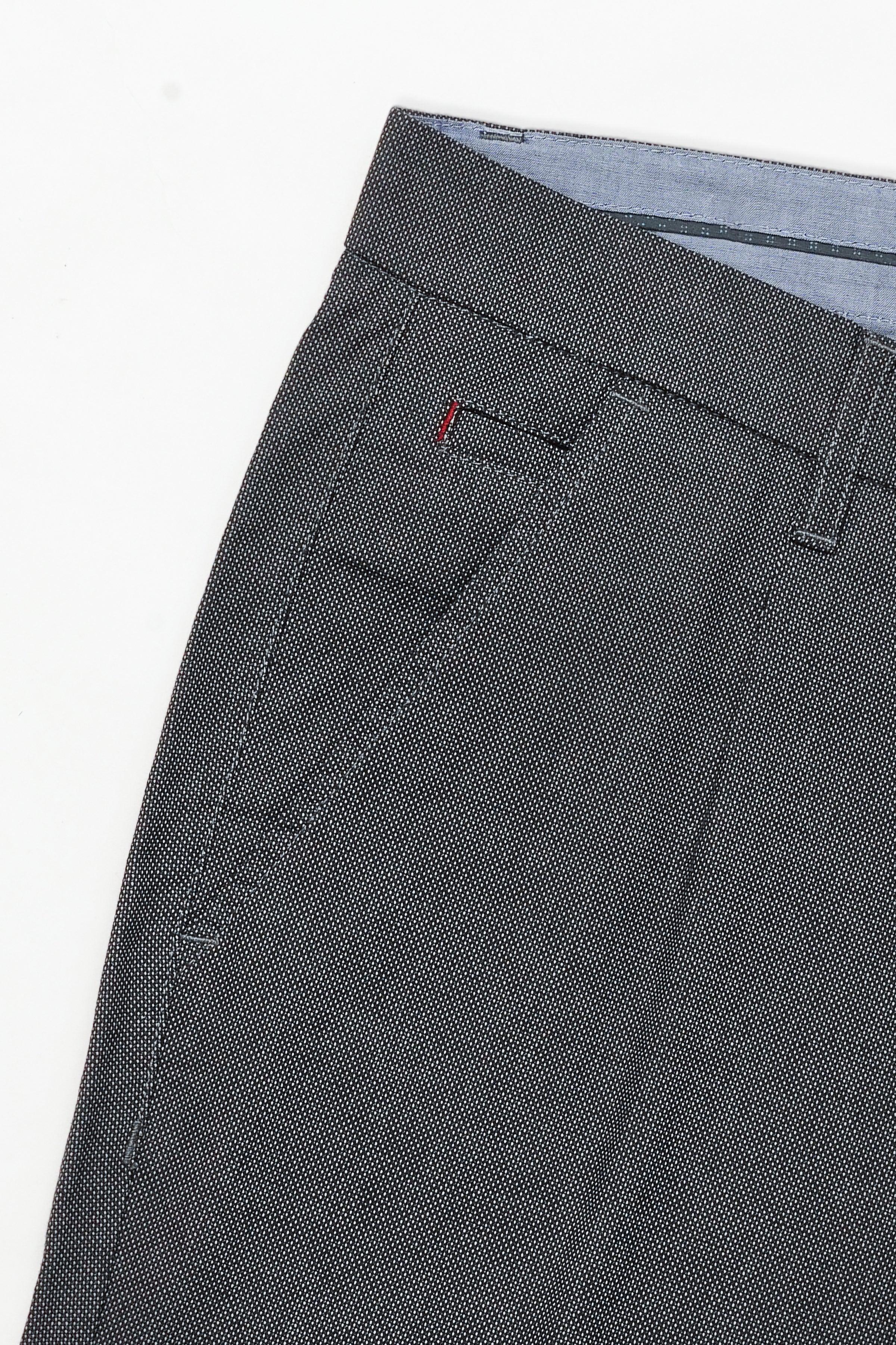 Casual pants side view showing pleats, belt loops, and trouser cuff hem.
