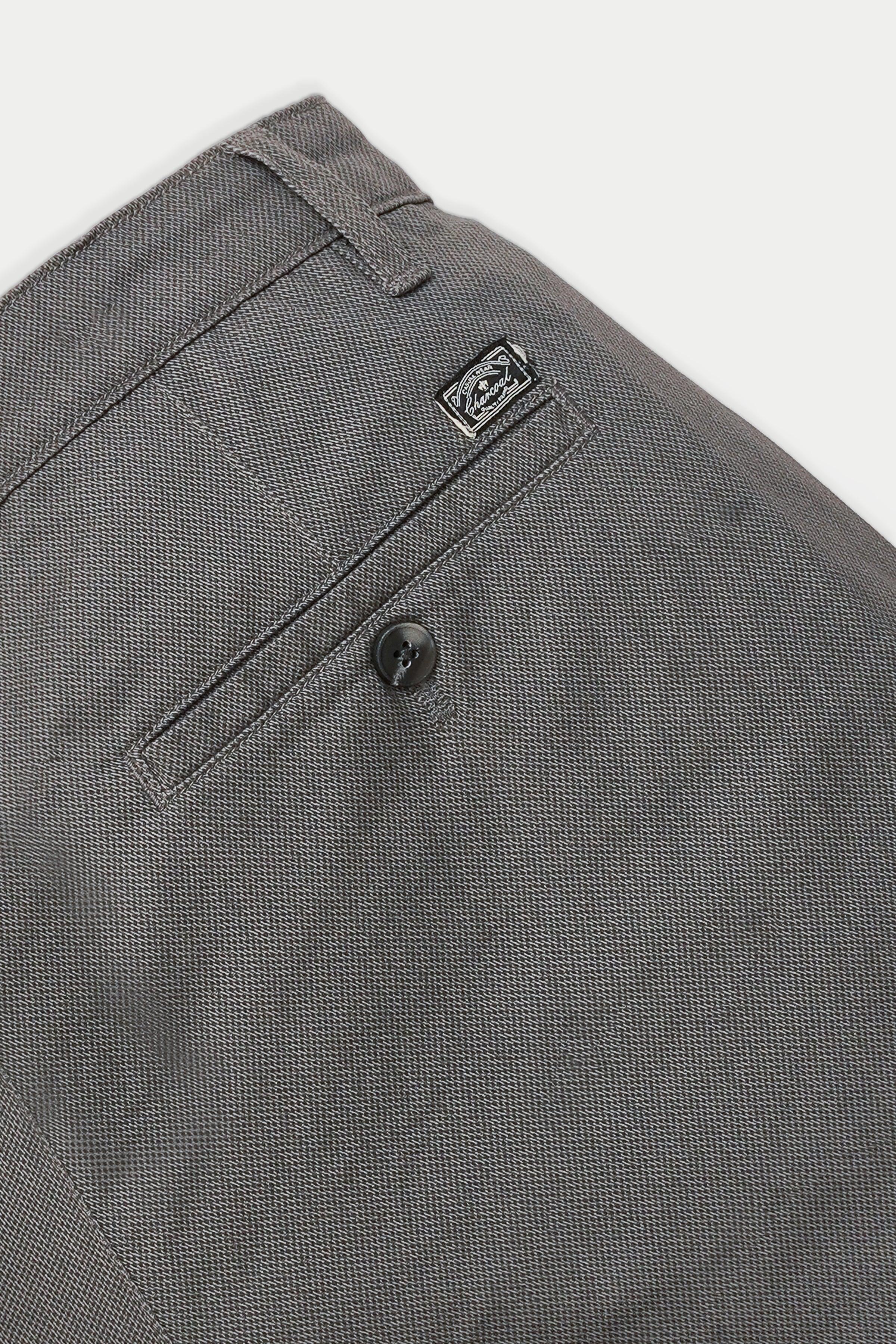 Grey casual pants back pocket with button and brand patch