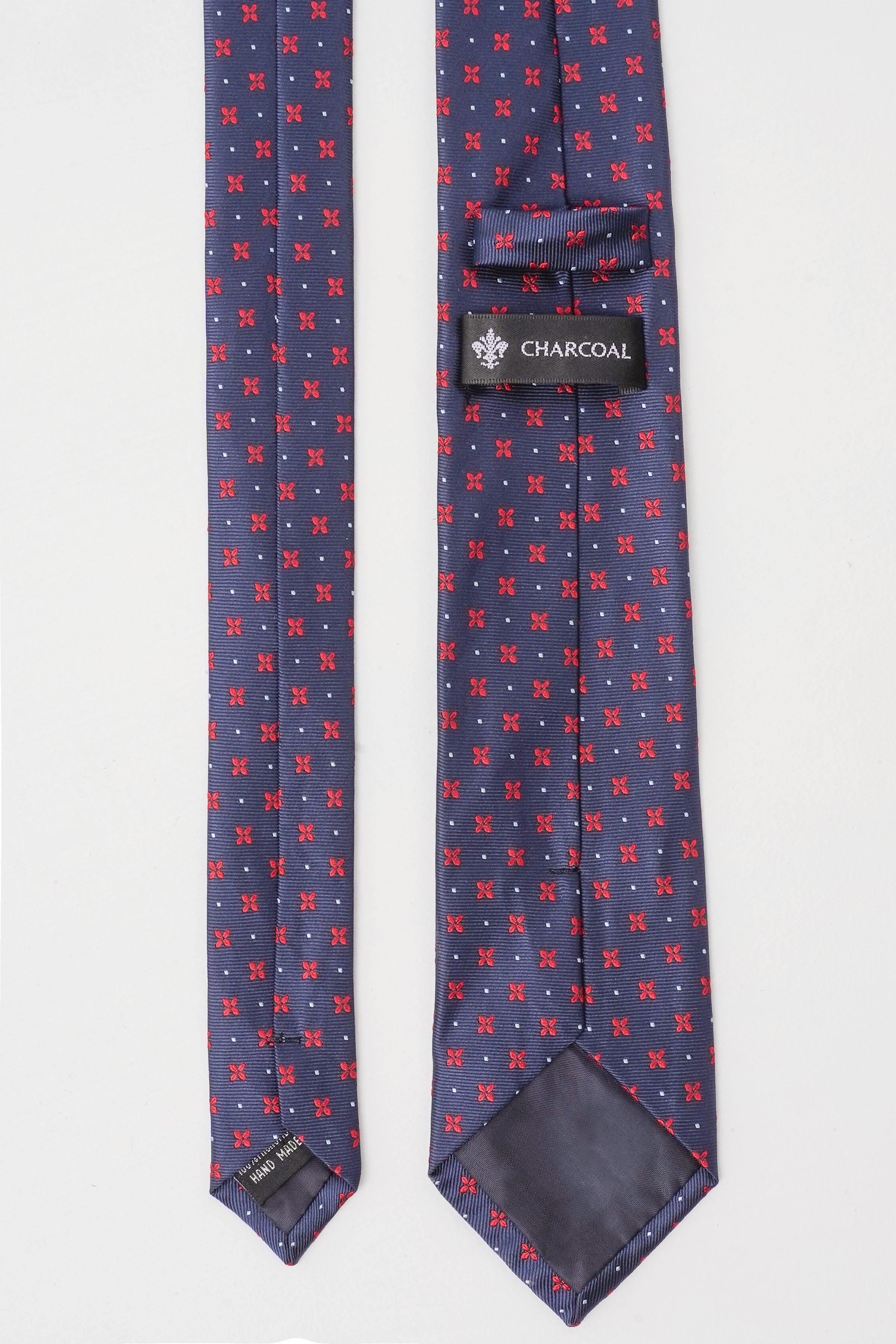 Navy poly silk tie with small red pattern and CHARCOAL label keeper