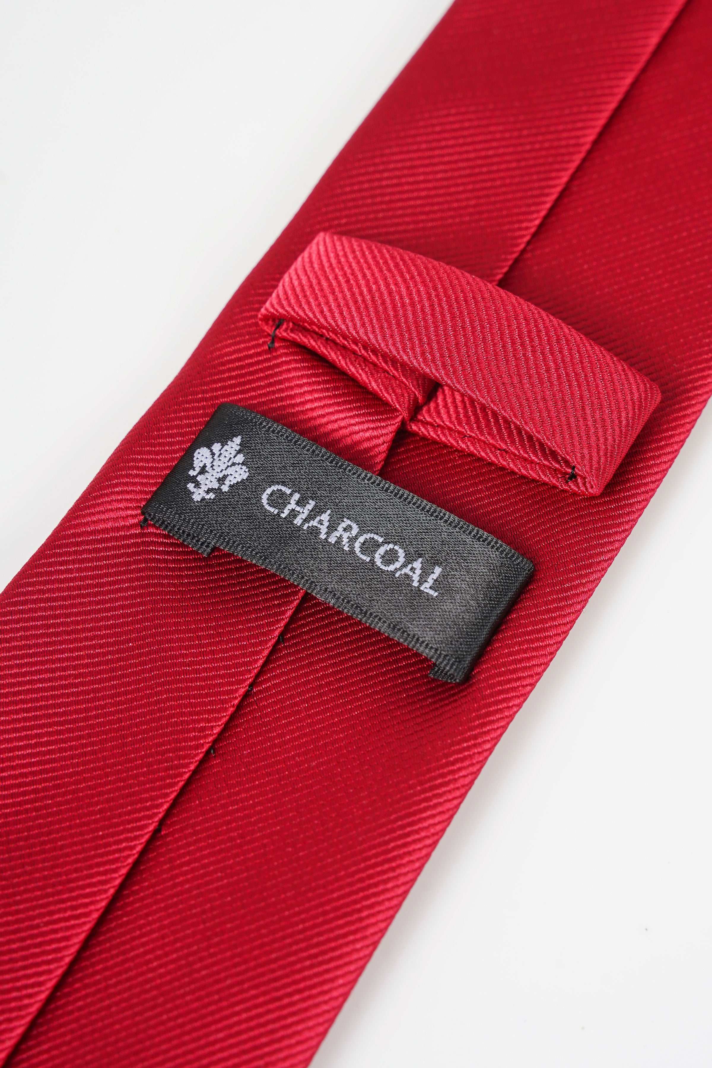 Red poly silk necktie with Charcoal brand label on inside keeper