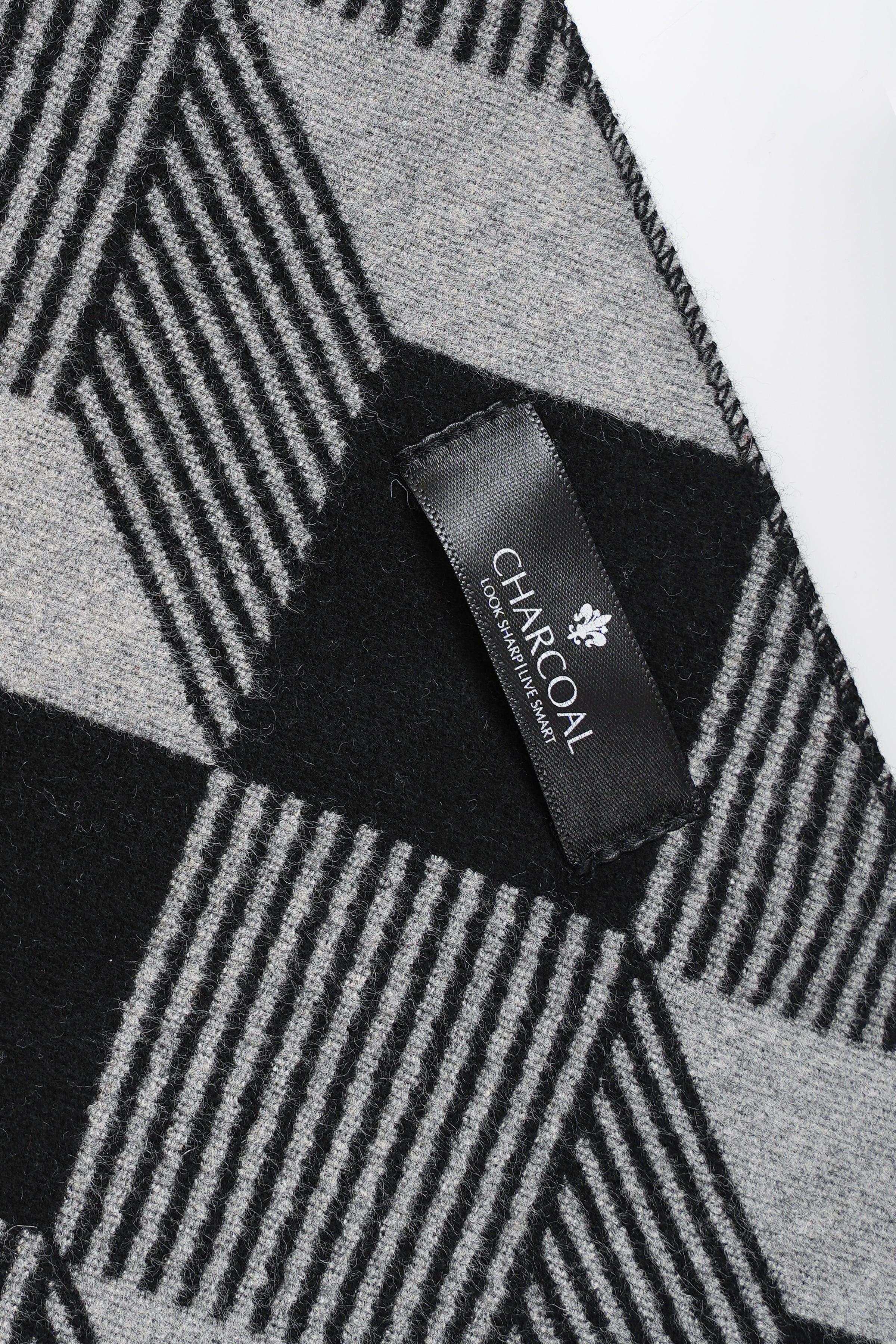 Black and white plaid scarf corner with stitched fabric label