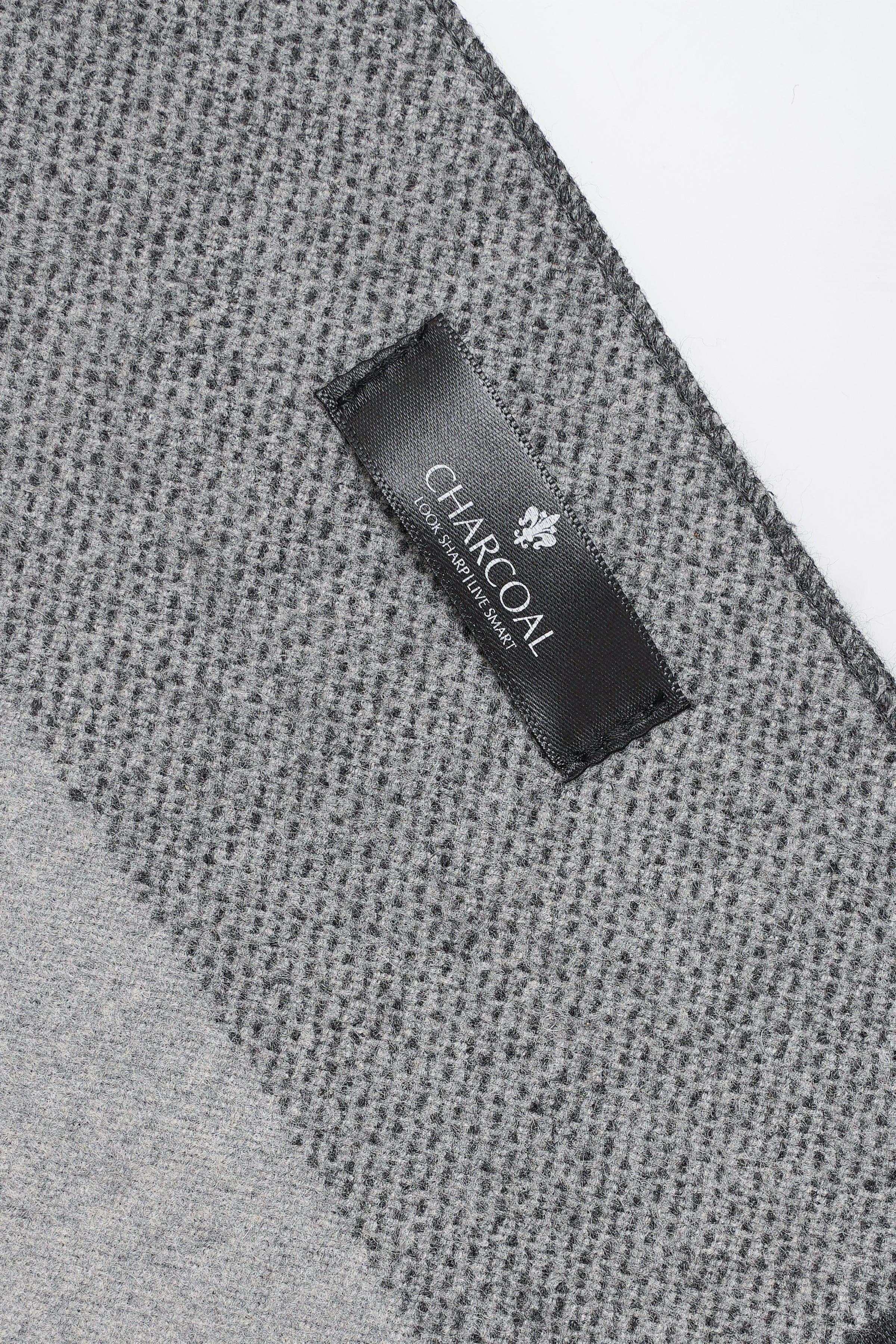 Charcoal label on gray knit scarf with fine textured weave