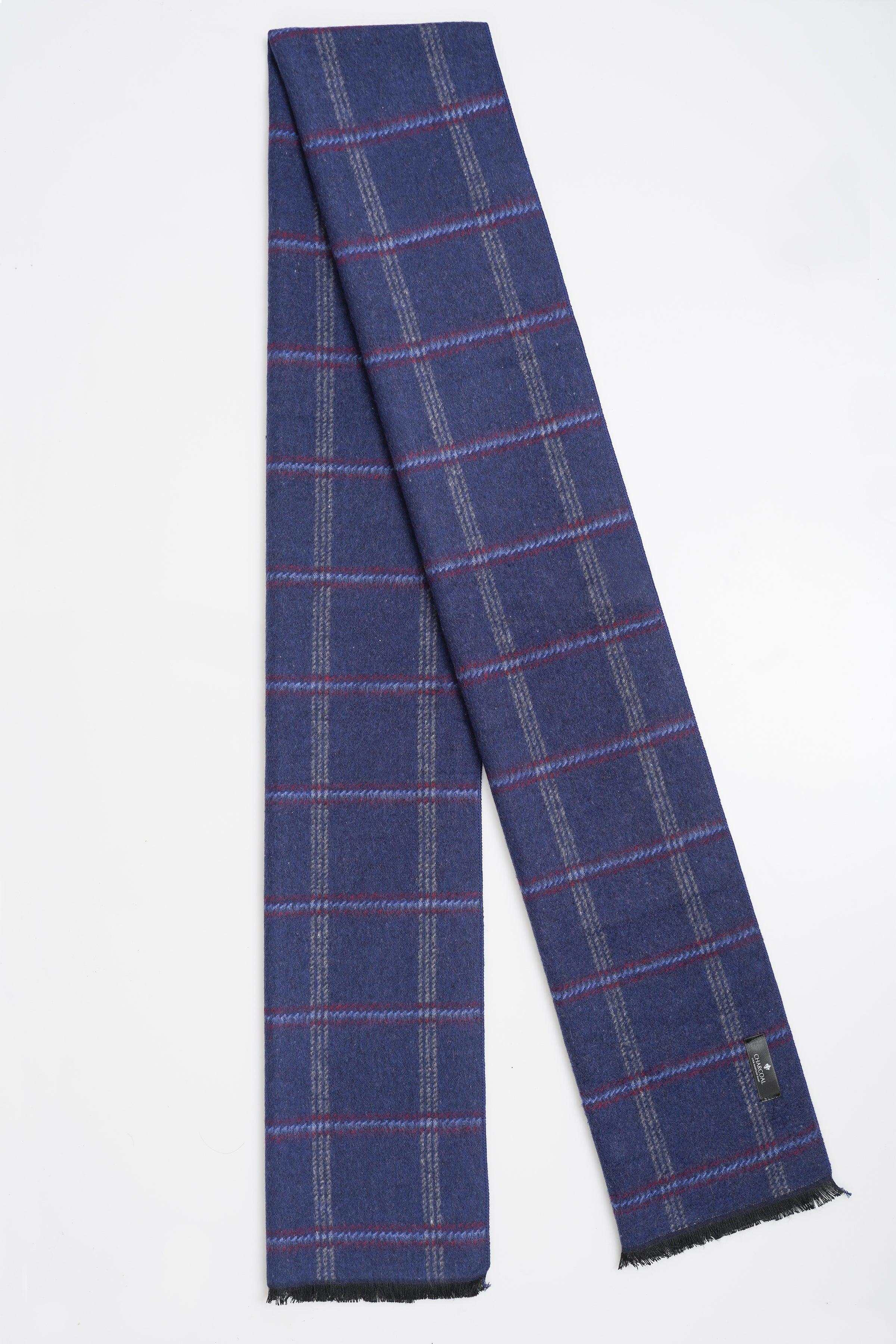 Navy plaid scarf with red grid stripes, fringed ends, draped style