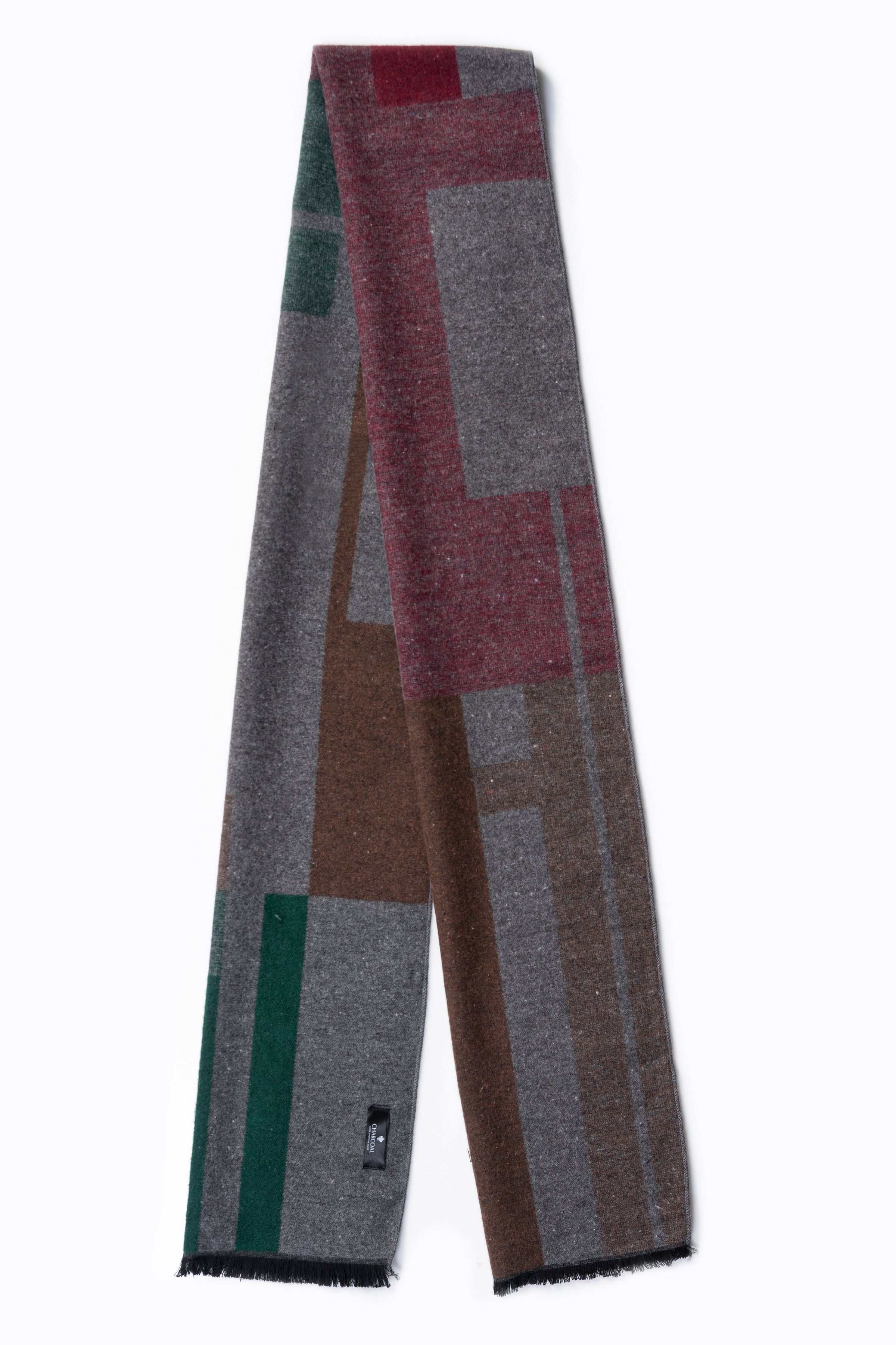 Patchwork scarf with gray, green, and brown blocks, fringed ends