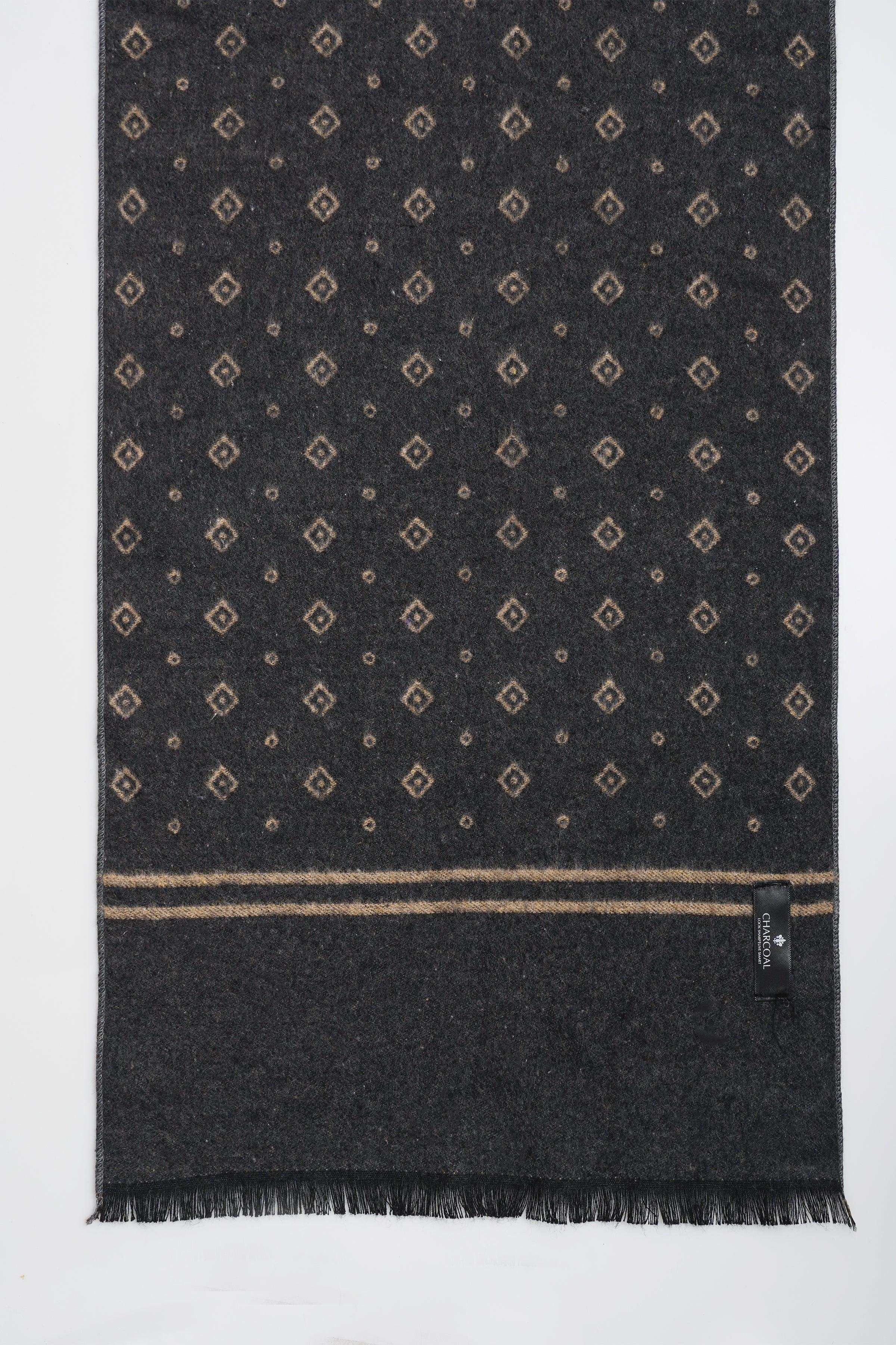 Dark navy scarf with small geometric motif, tan border stripe and fringe ends