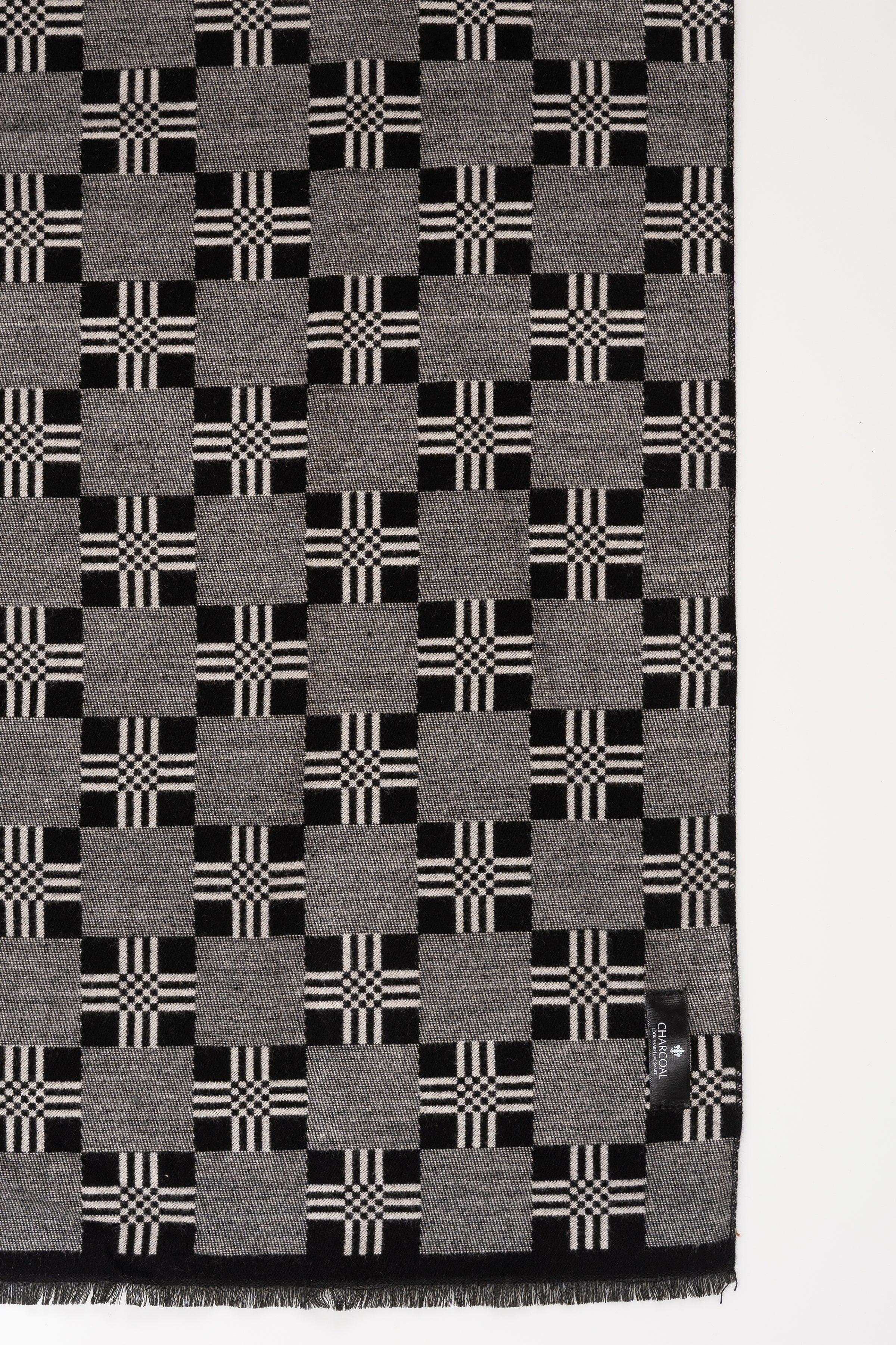 Dark gray plaid scarf with black and white checks, fringed edges.