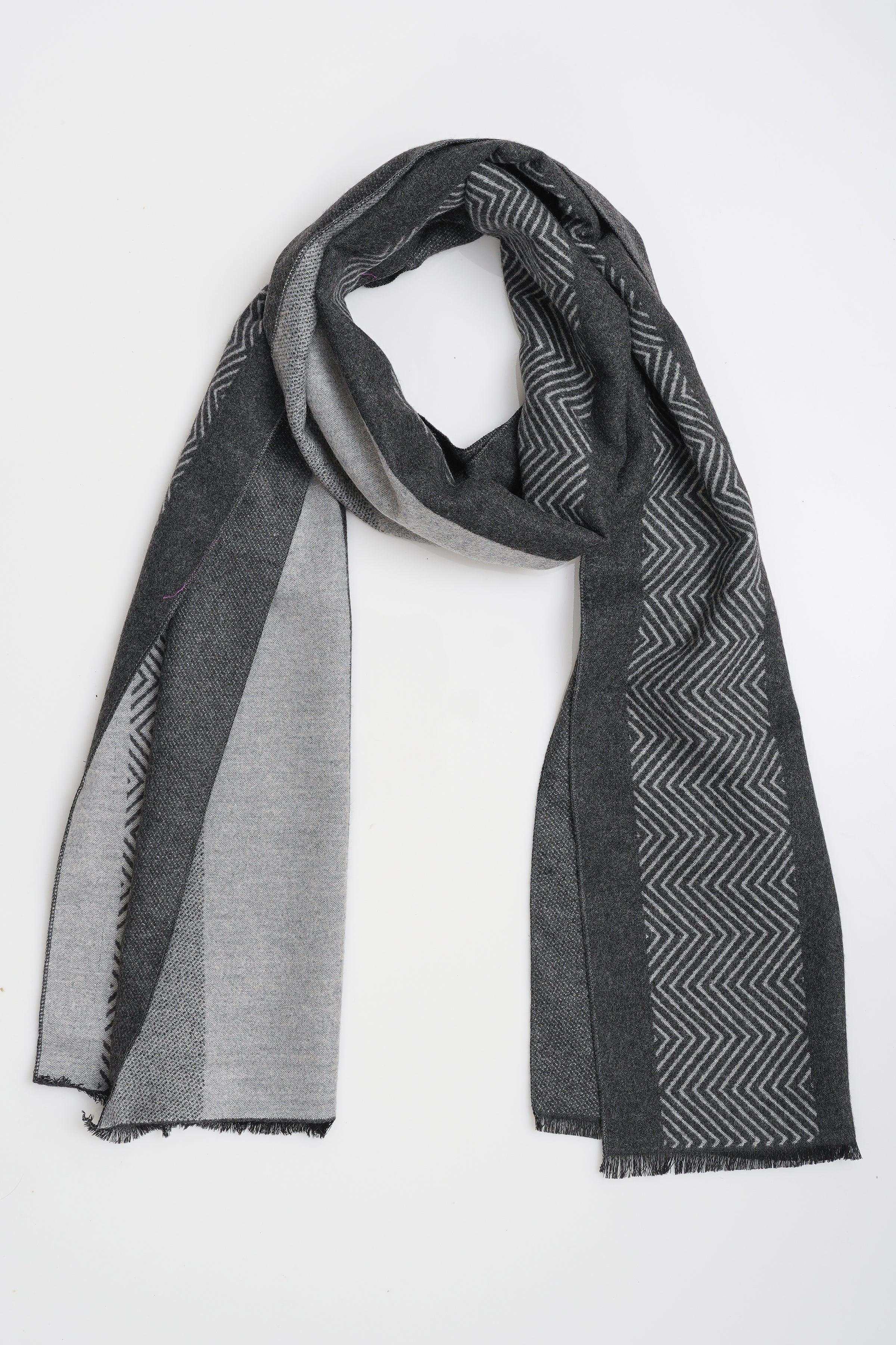 Two-tone gray scarf with black zigzag panel and fringed ends, folded
