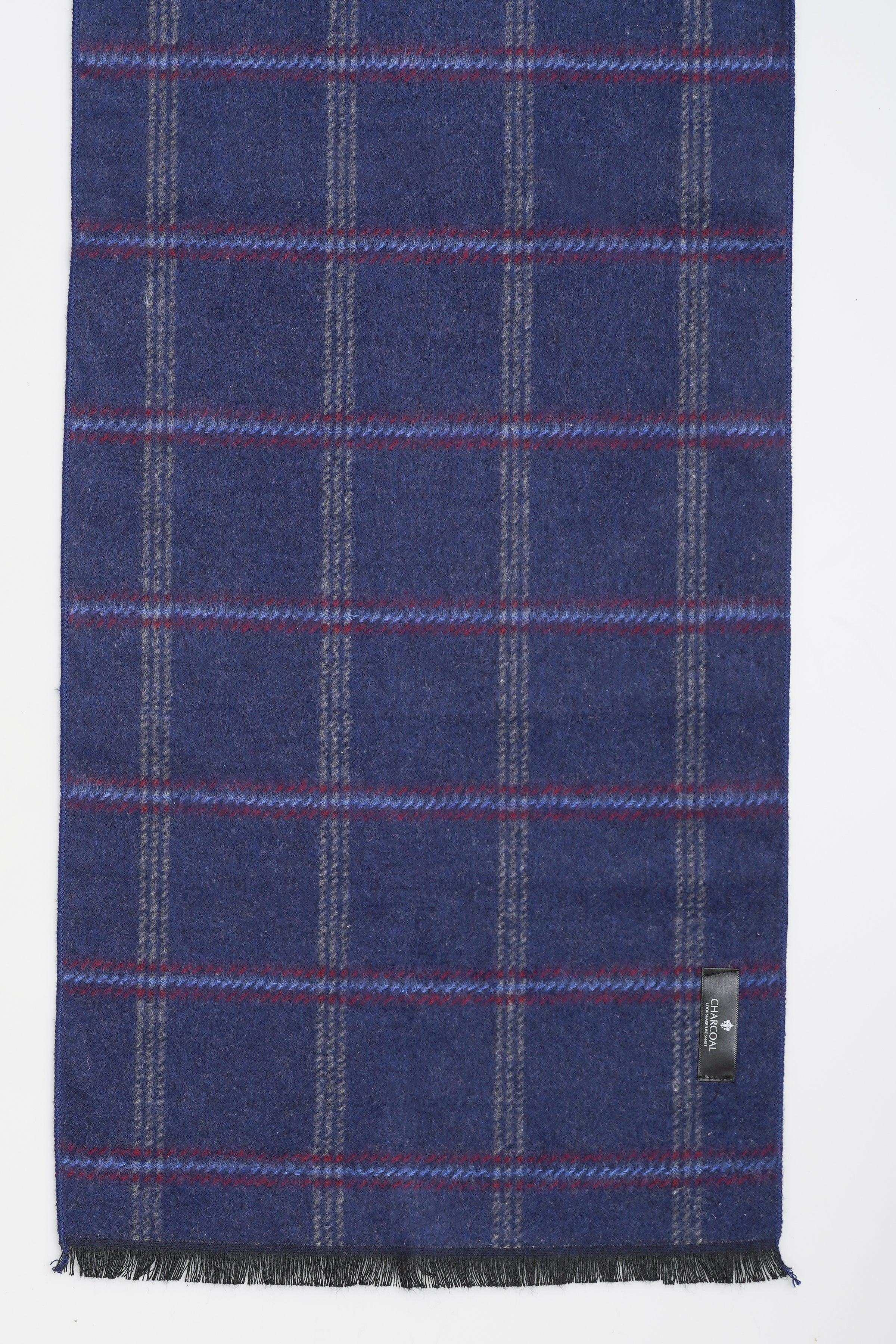 Navy plaid scarf fabric with red grid lines and fringed hem, small tag