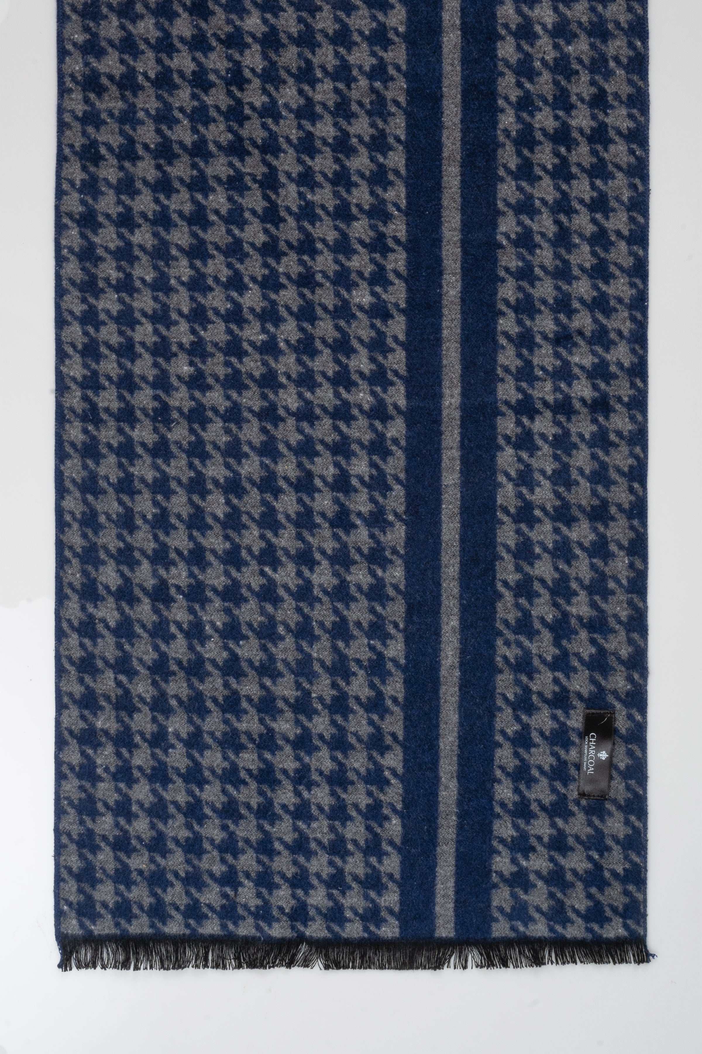 Blue scarf folded view with houndstooth pattern and vertical striped band, fringed hem