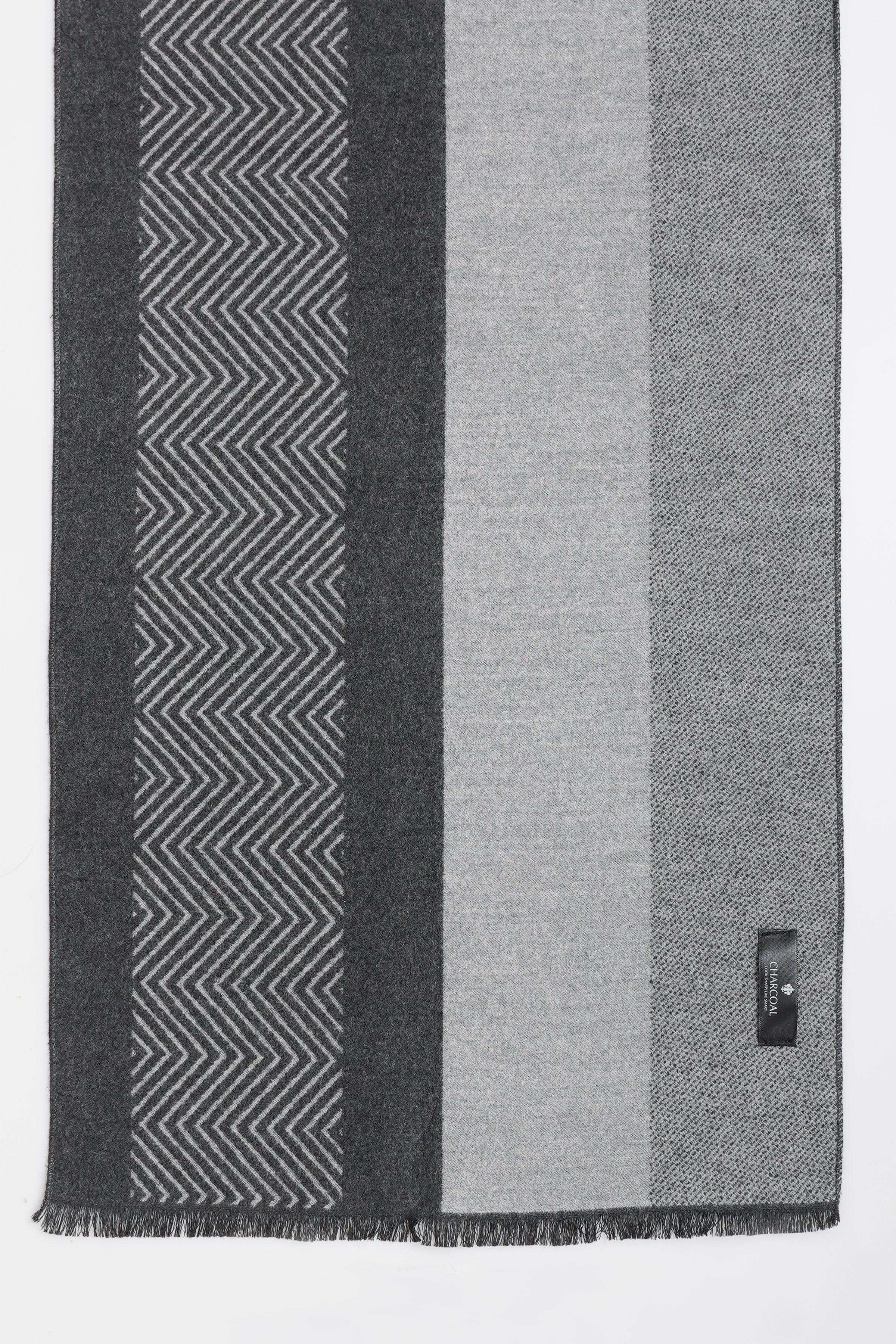 Gray scarf with black chevron zigzag stripe pattern and soft fringe ends