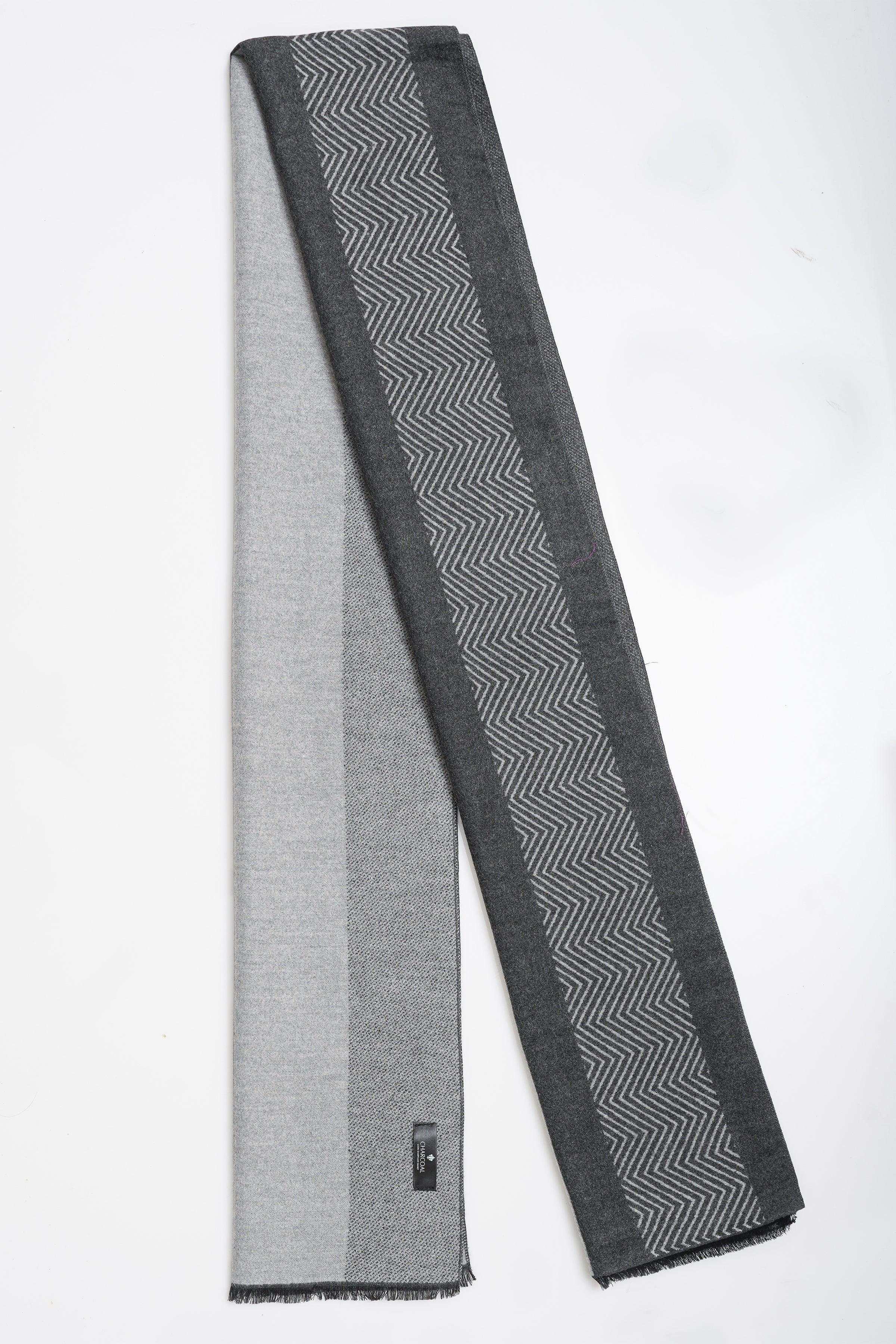 Gray scarf with bold black zigzag stripe across the center and fringed ends