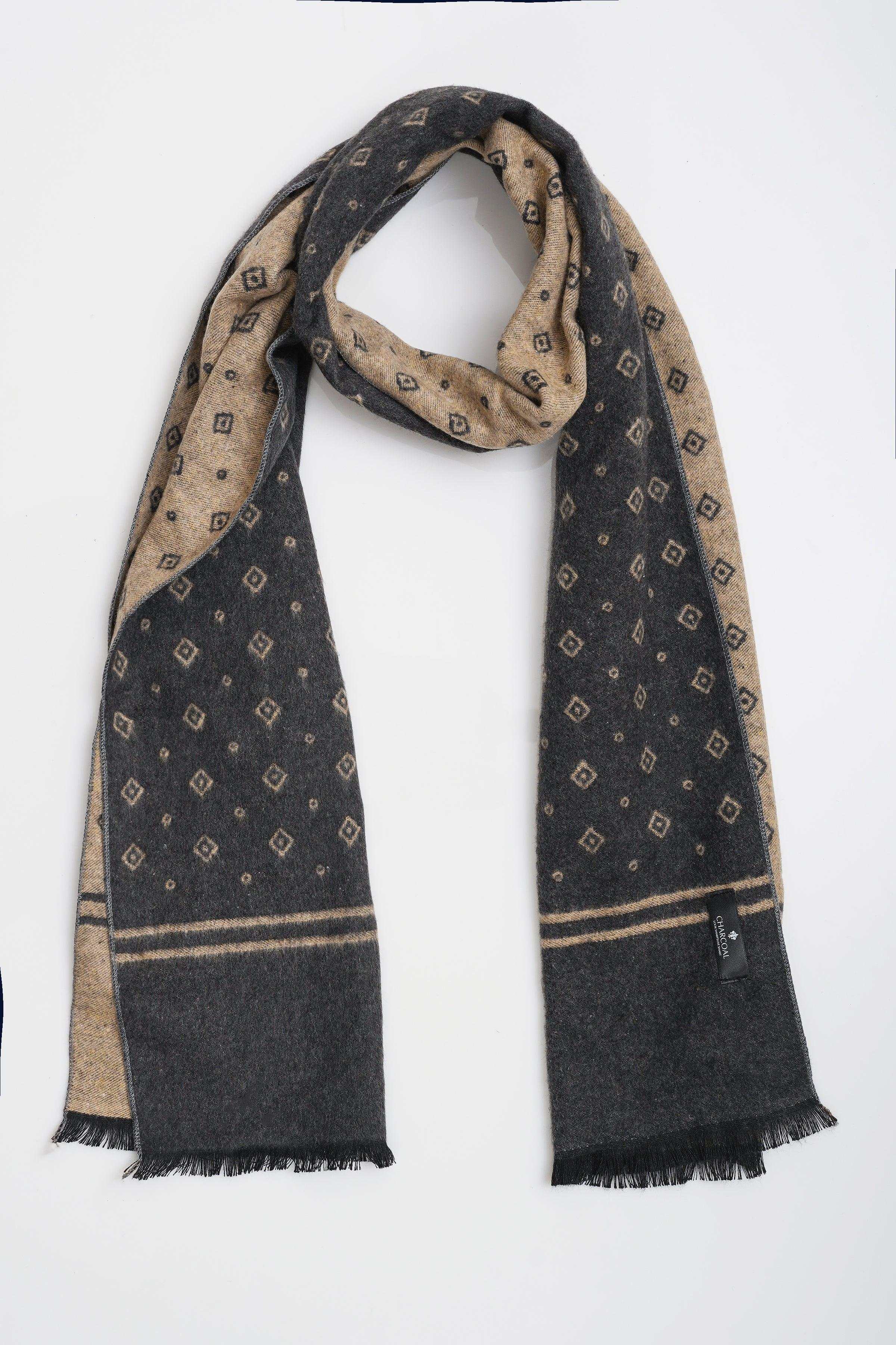 Draped dark navy scarf with tan geometric print, stripe border and fringed ends