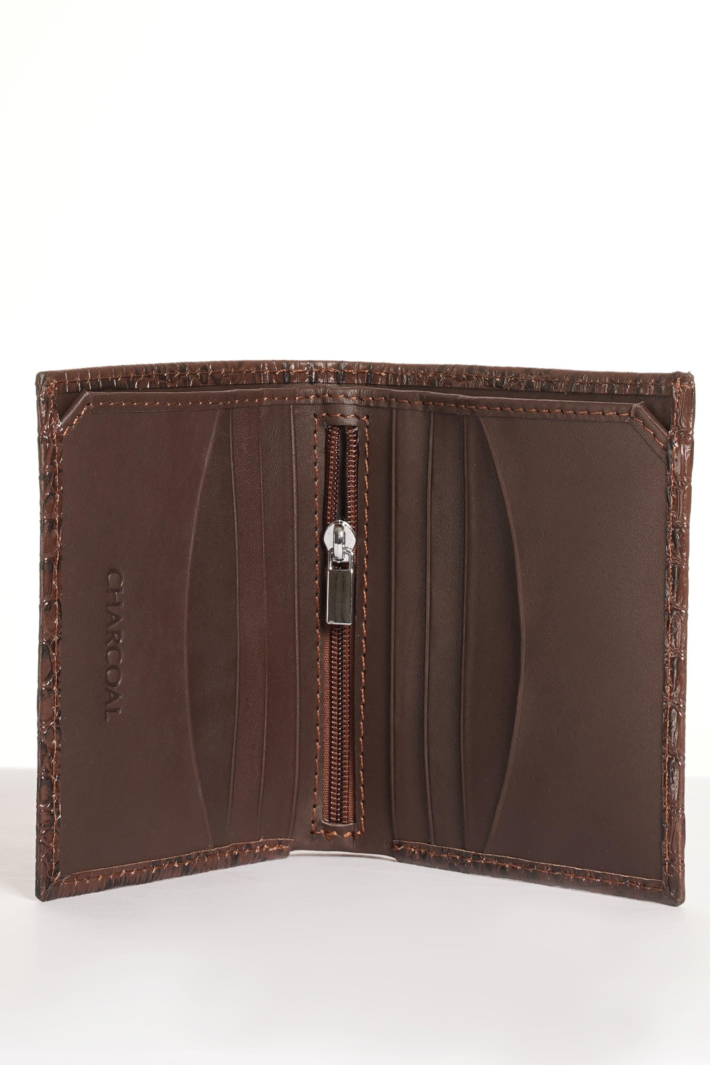 Brown croc-textured leather wallet open with zip pocket and card panels