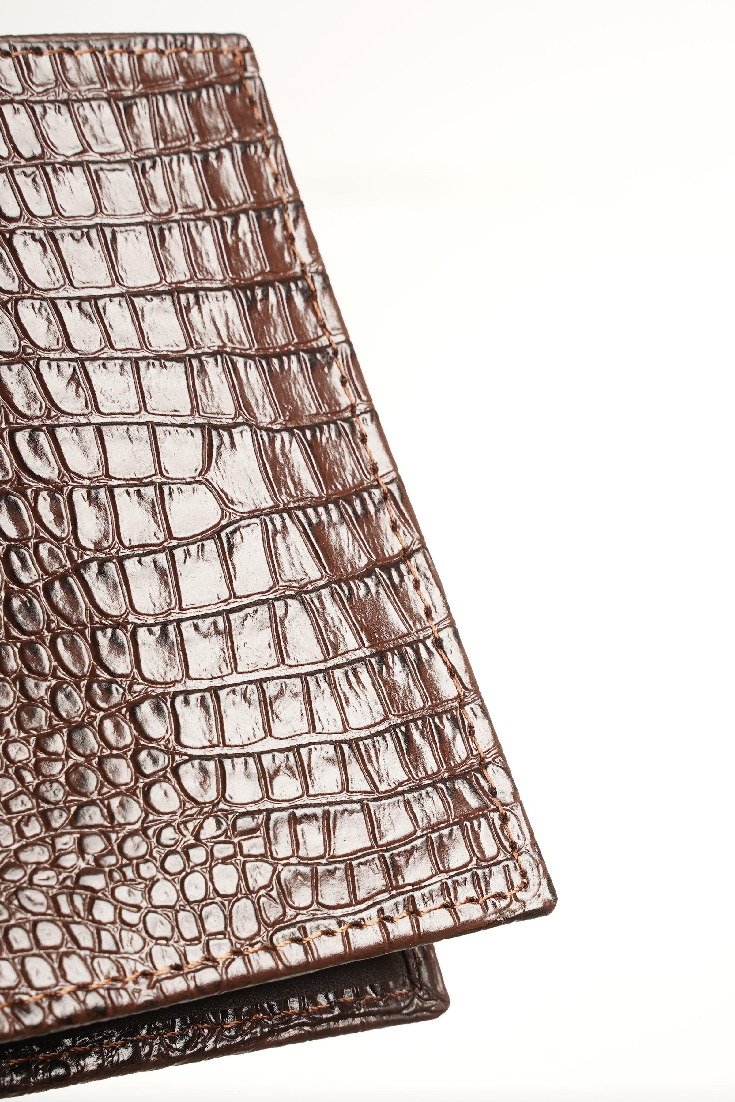 Brown croc-embossed leather wallet exterior, close-up of texture