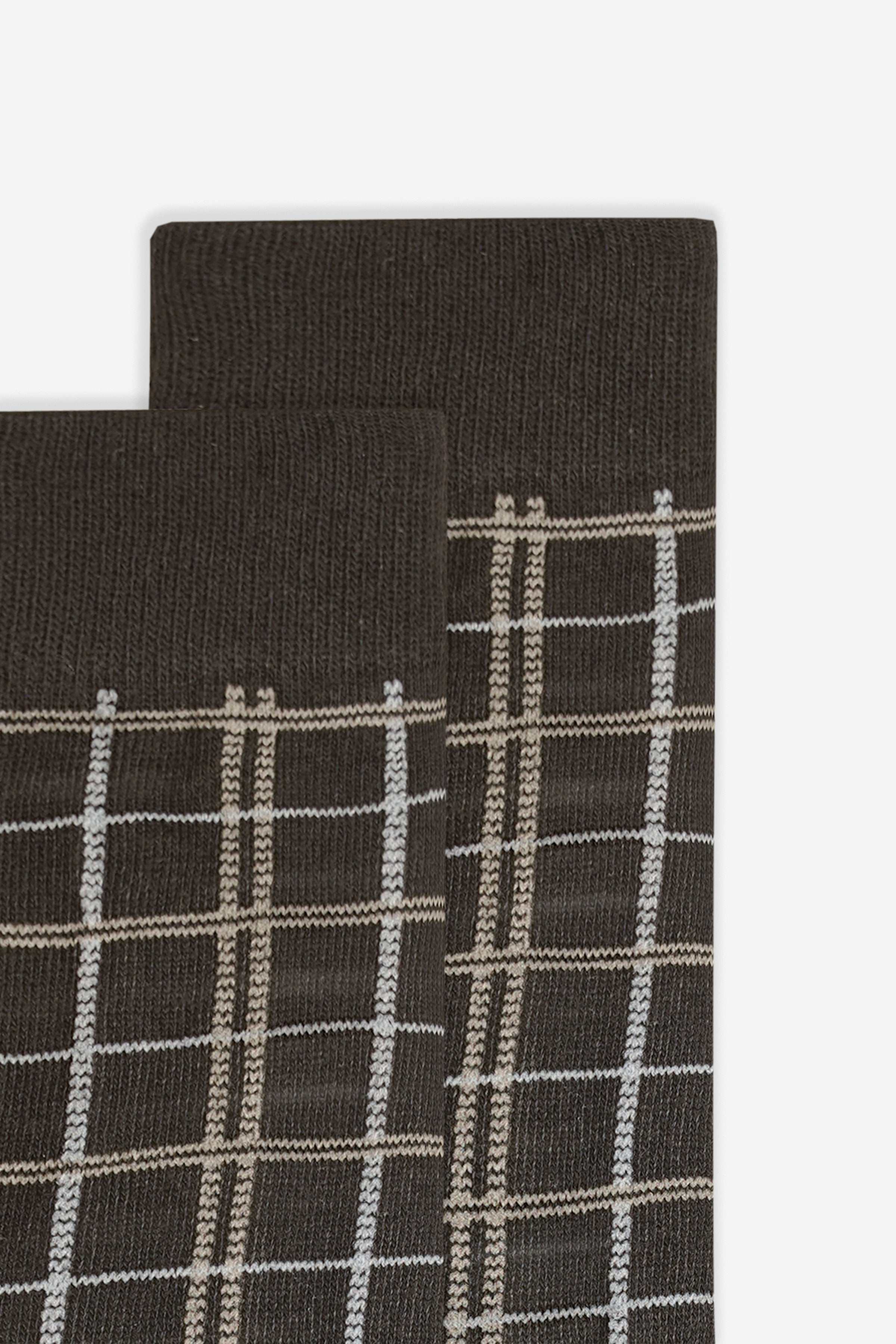 Wool sock cuff close-up with light plaid grid stitching